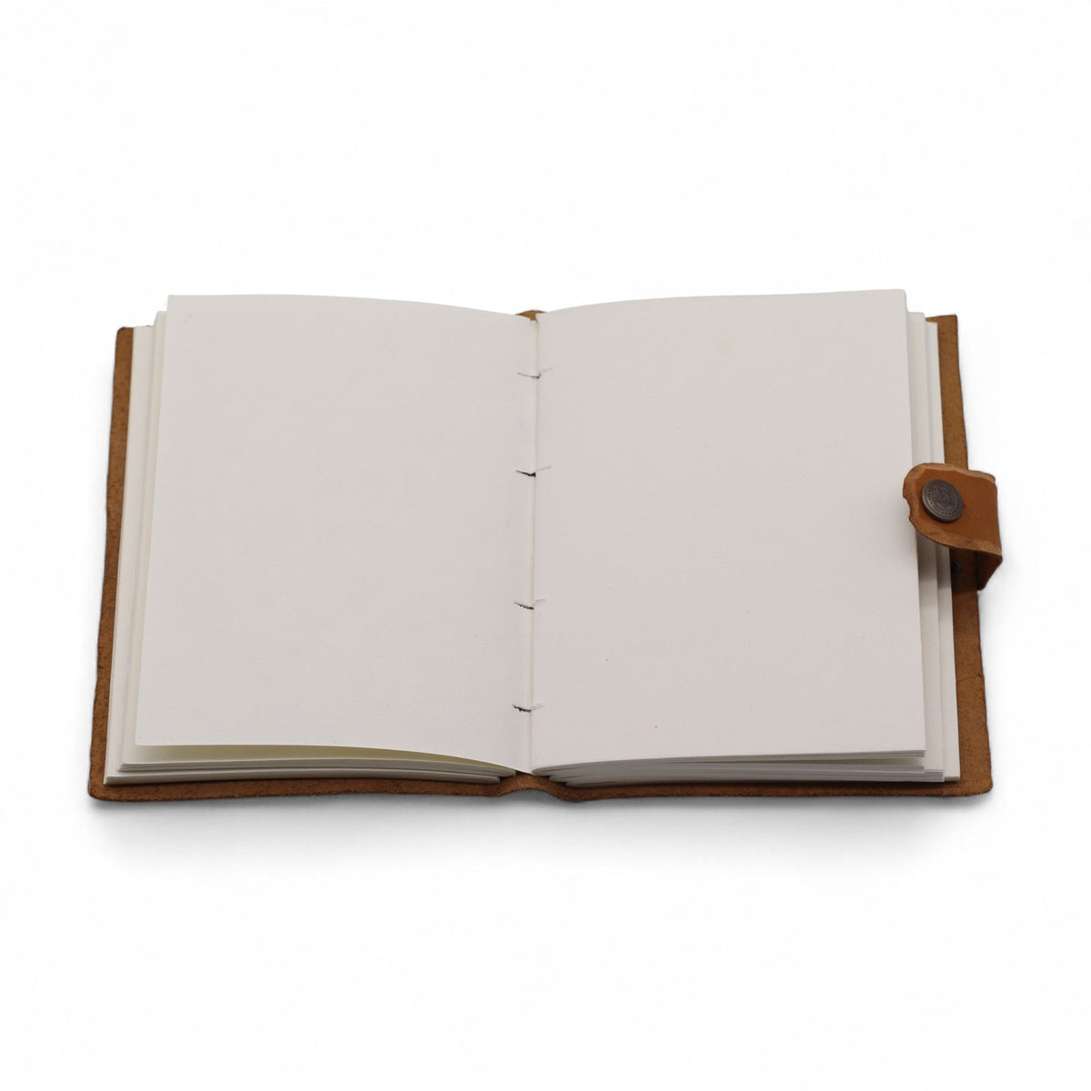 Leather-Bound Floral Notebook - Medium Tan, Strap, 200 Pages shown open to blank cream pages with fastening strap extended by Quintessential Holistic Health Ltd
