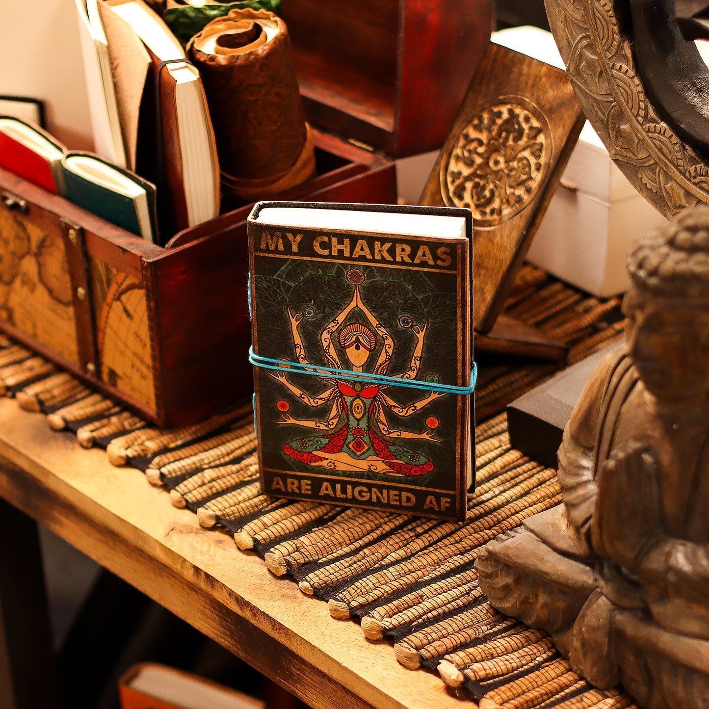 Handmade Leather-Bound Eco-Friendly Journal with Wrap – My Chakras Are Aligned AF product packaging on clean background from Quintessential Holistic Health Ltd