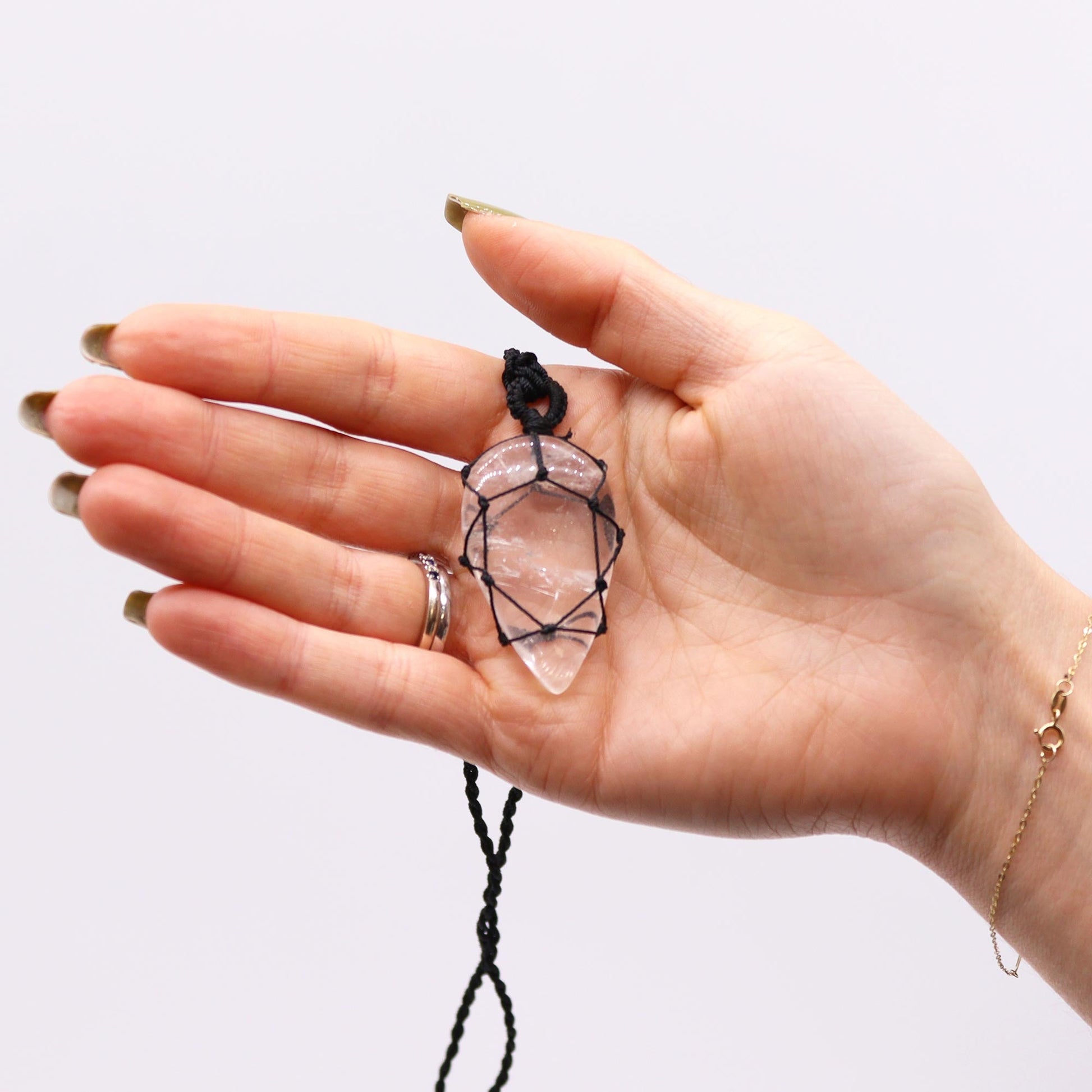 Handmade Laced Gemstone Pendant - Teardrop / Rock Quartz product packaging on clean background from Quintessential Holistic Health Ltd