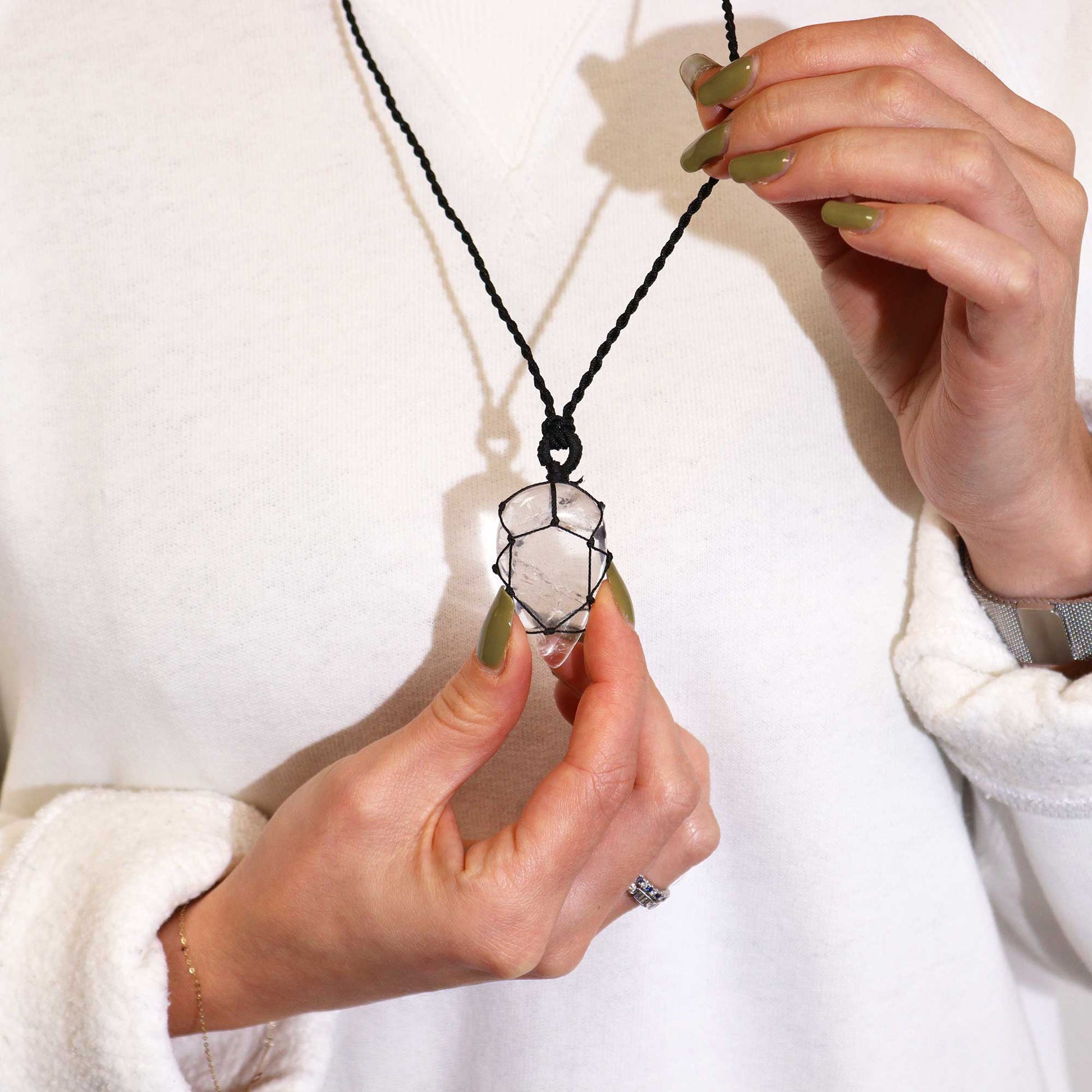 Handmade Laced Gemstone Pendant - Teardrop / Rock Quartz product packaging on clean background from Quintessential Holistic Health Ltd