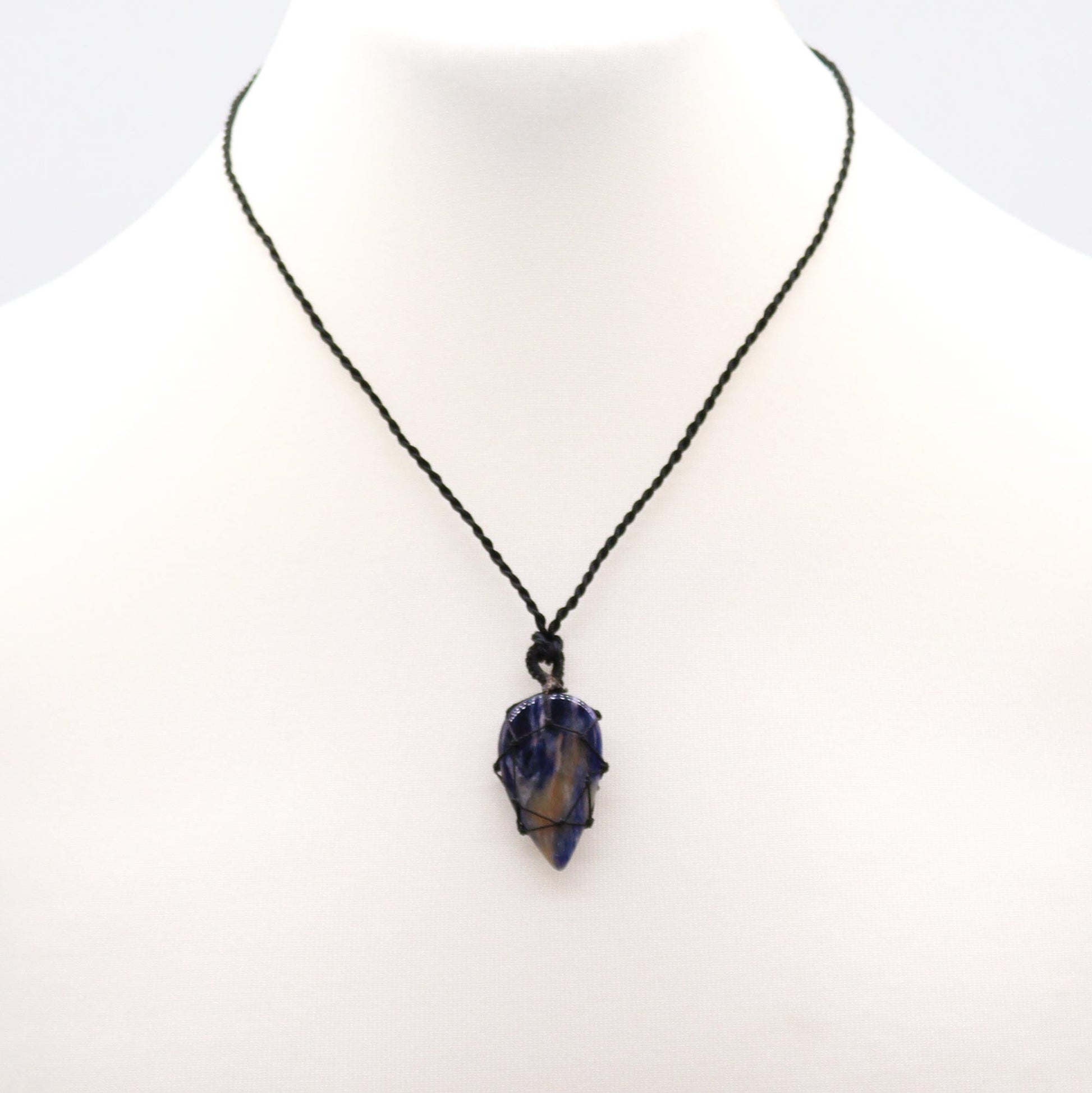 Handmade Laced Gemstone Pendant - Teardrop / Sodalite product packaging on clean background from Quintessential Holistic Health Ltd