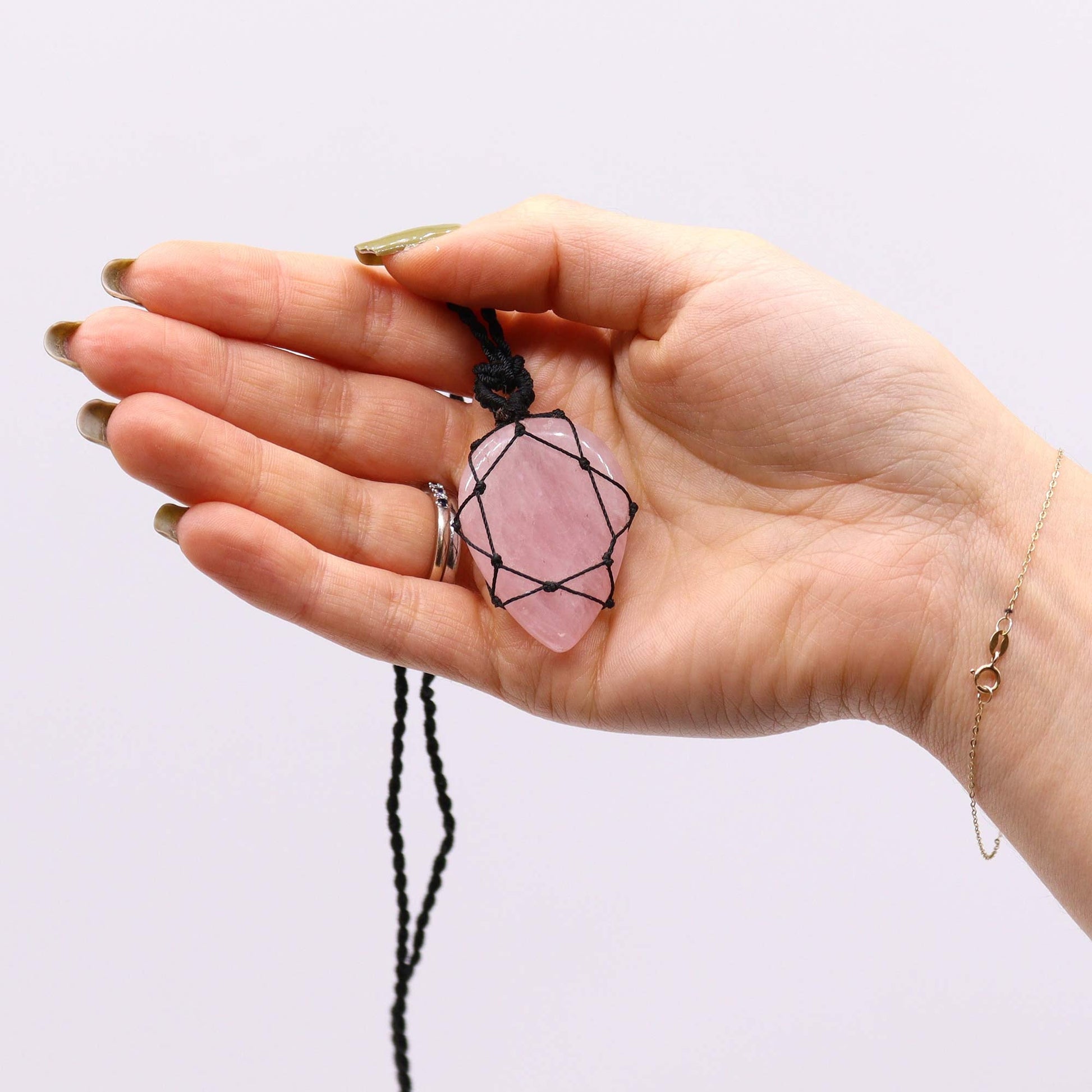 Handmade Laced Gemstone Pendant - Teardrop / Rose Quartz product packaging on clean background from Quintessential Holistic Health Ltd
