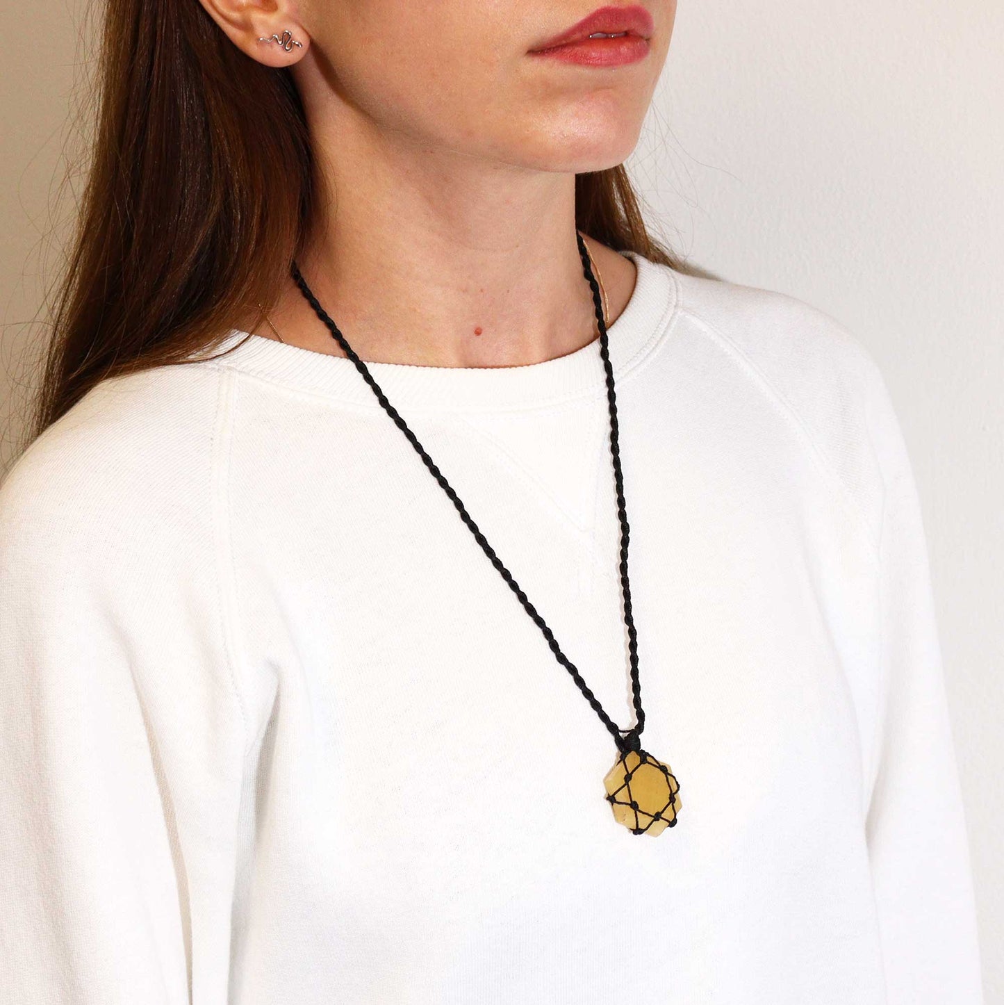 Handmade Laced Gemstone Pendant - Hexagonal / Yellow Quartz product packaging on clean background from Quintessential Holistic Health Ltd