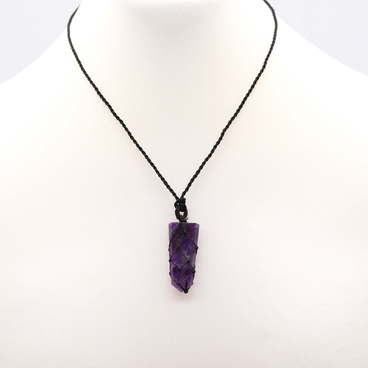 Handmade Laced Gemstone Pendant - Flat Point / Amethyst product packaging on clean background from Quintessential Holistic Health Ltd