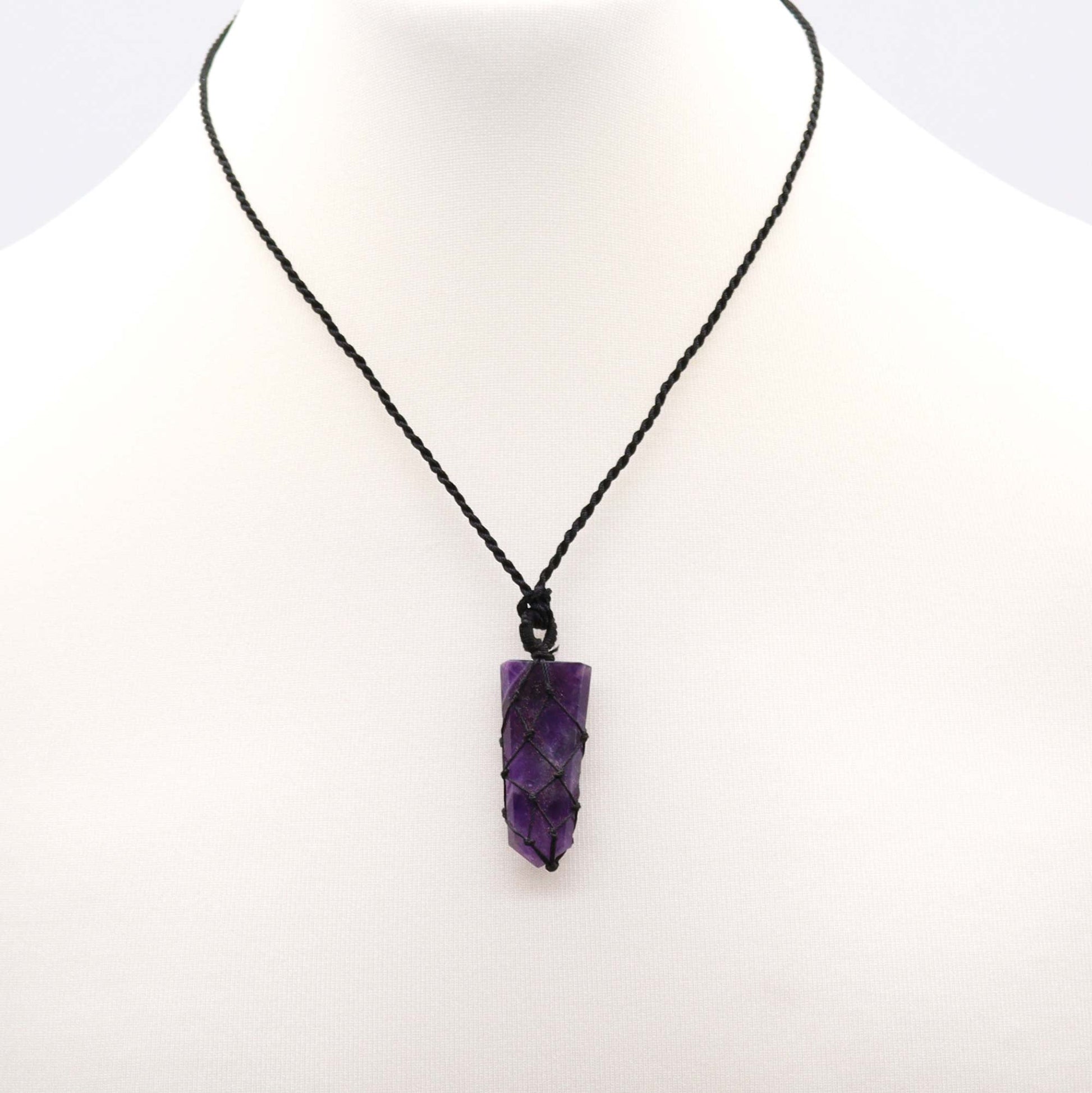 Handmade Laced Gemstone Pendant - Flat Point / Amethyst product packaging on clean background from Quintessential Holistic Health Ltd