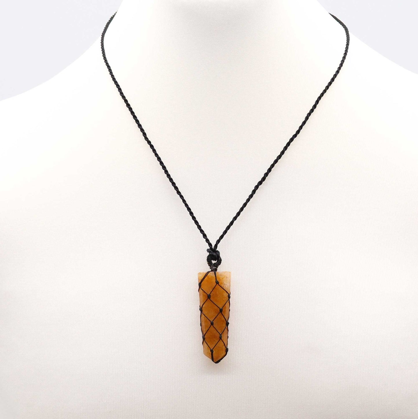 Handmade Laced Gemstone Pendant - Flat Point / Golden Quartz product packaging on clean background from Quintessential Holistic Health Ltd