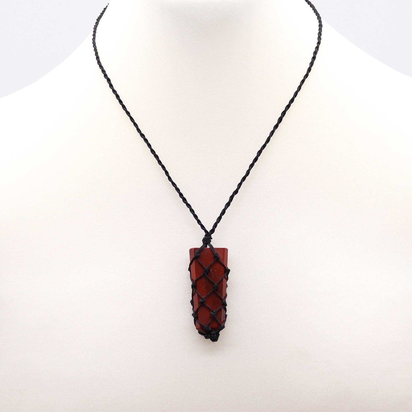 Handmade Laced Gemstone Pendant - Flat Point / Red Jasper product packaging on clean background from Quintessential Holistic Health Ltd