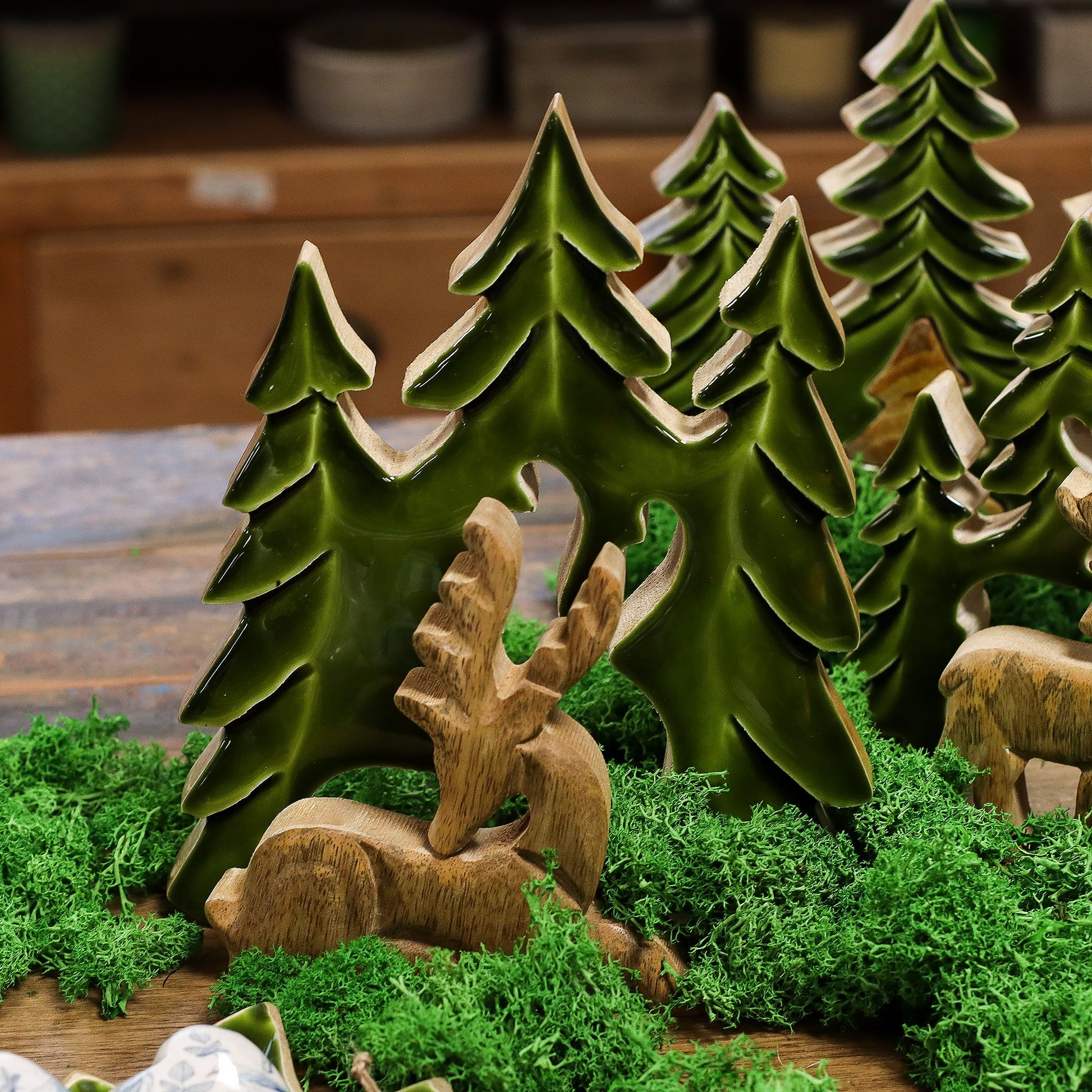 Handcrafted Enamel Wooden 3D Tree Decoration - Resting Deer in the Forest product packaging on clean background from Quintessential Holistic Health Ltd