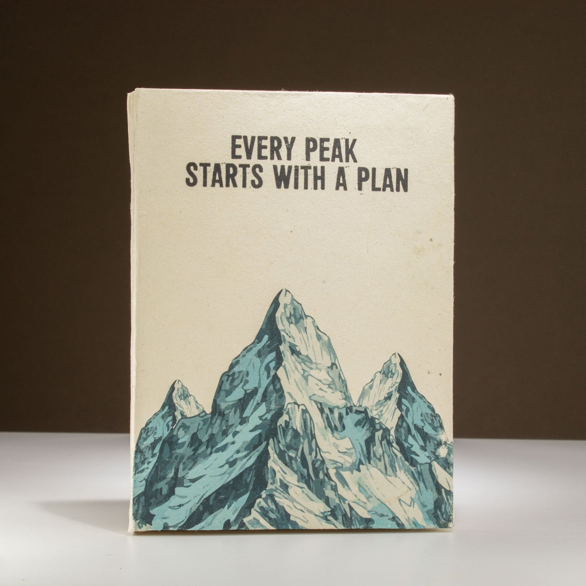 A5 Eco-Friendly Lokta Paper Journal inc Bookmark - Every Peak Starts with a Plan product packaging on clean background from Quintessential Holistic Health Ltd