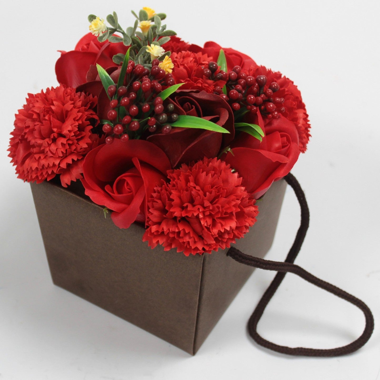 Luxury Soap Flower Bouquet Box - Reds, with red roses, red ruffled blooms, dense berry clusters and green leaves in a dark brown box, by Quintessential Holistic Health Ltd