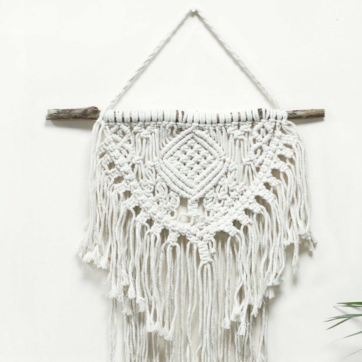 Handcrafted Cotton Macrame Wall Hanging - Home and Heart product packaging on clean background from Quintessential Holistic Health Ltd