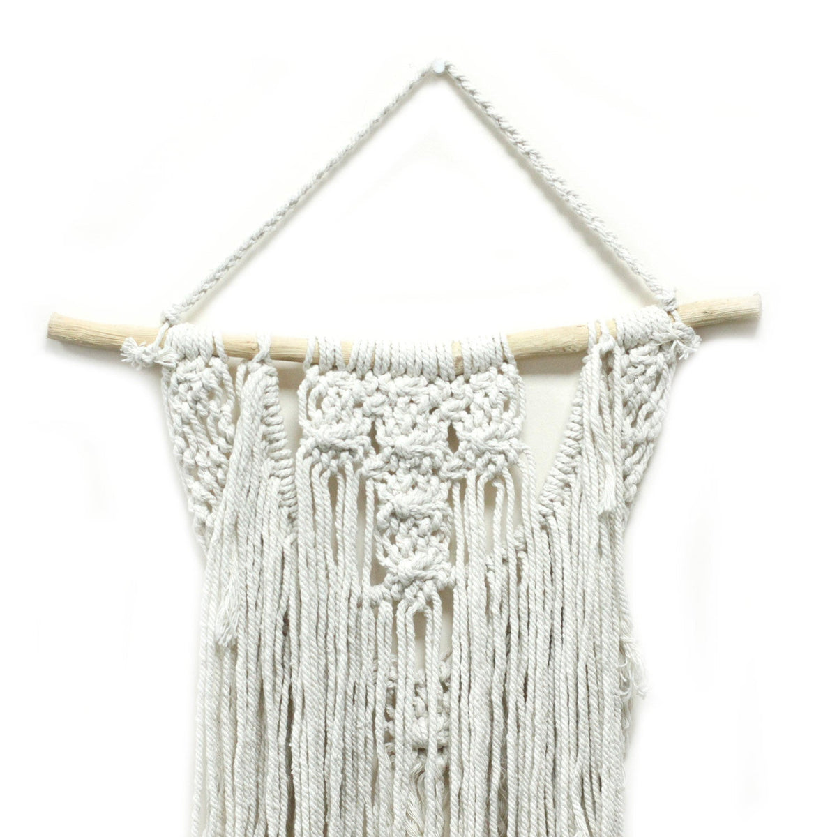 Handcrafted Cotton Macramé Wall Hanging - The Wedding Blessing showing knotted diamond motifs and long tassels beneath a wooden dowel by Quintessential Holistic Health Ltd