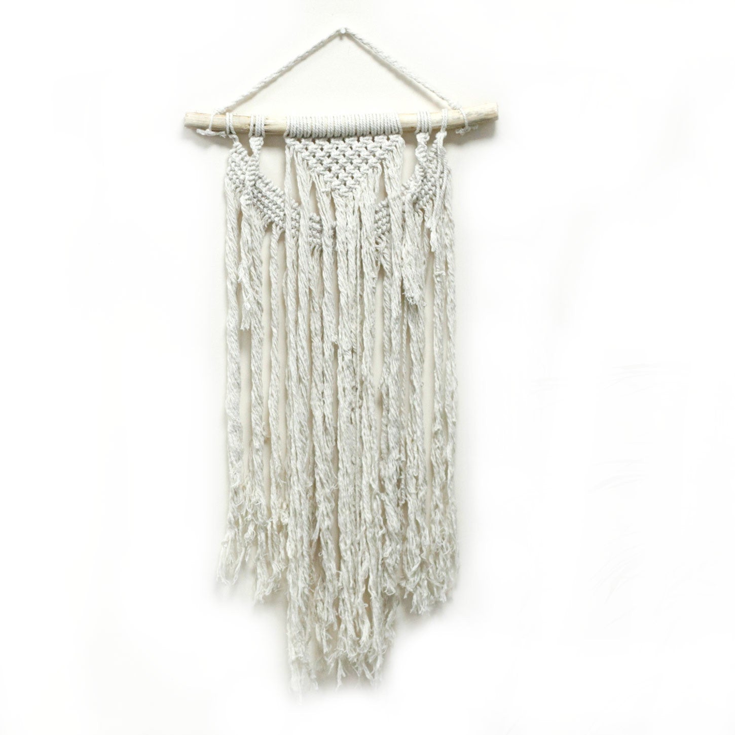 Handcrafted Cotton Macramé Wall Hanging - Force of Nature, long narrow knotted panel suspended from a wooden bar by Quintessential Holistic Health Ltd