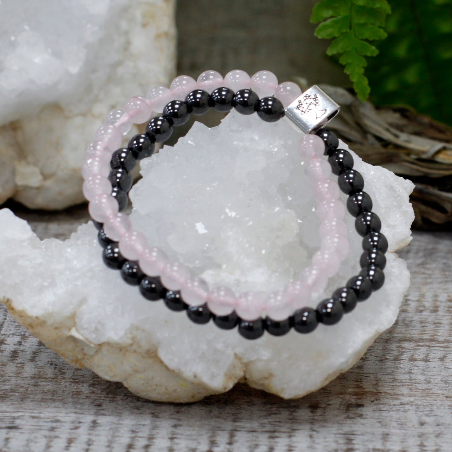 Handcrafted Gemstone Magnetic Bracelet - Rose Quartz / Love and Harmony product packaging on clean background from Quintessential Holistic Health Ltd