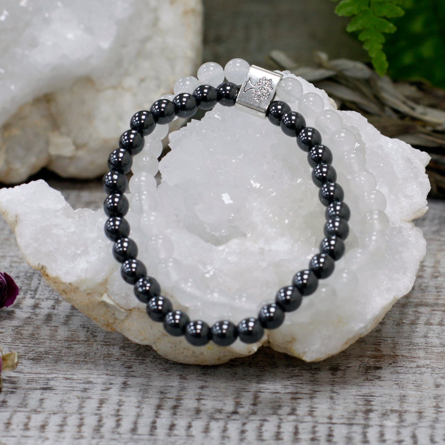 Handcrafted Gemstone Magnetic Bracelet - Rock Quartz / Clarity and Focus product packaging on clean background from Quintessential Holistic Health Ltd