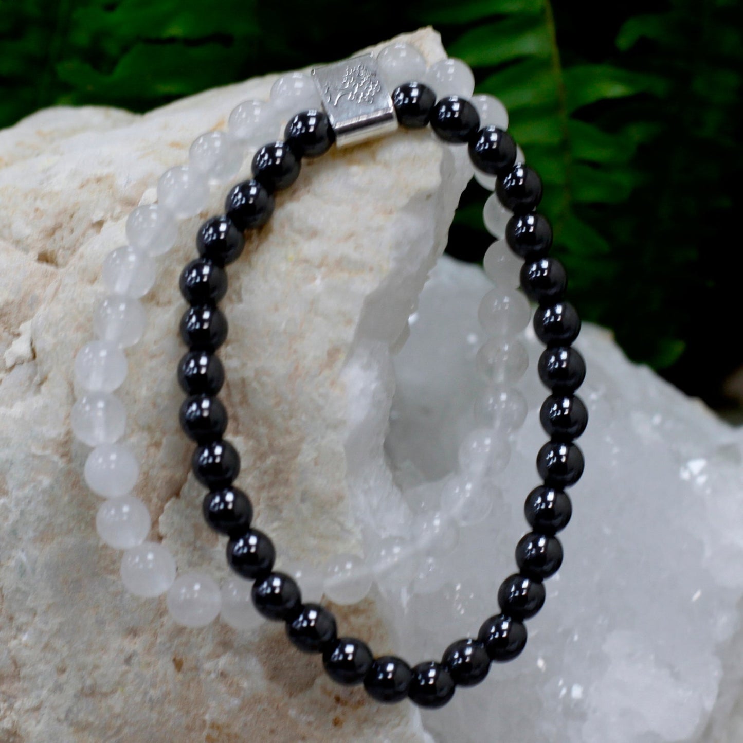 Handcrafted Gemstone Magnetic Bracelet - Rock Quartz / Clarity and Focus product packaging on clean background from Quintessential Holistic Health Ltd