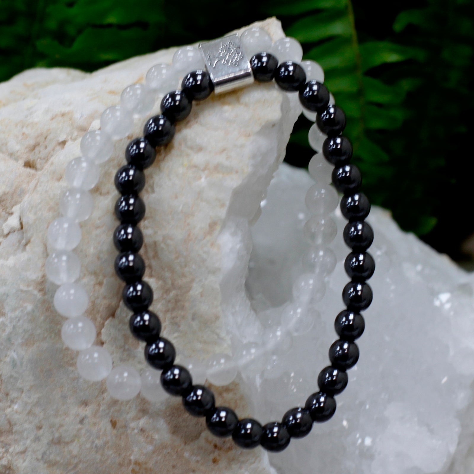 Handcrafted Gemstone Magnetic Bracelet - Rock Quartz / Clarity and Focus product packaging on clean background from Quintessential Holistic Health Ltd
