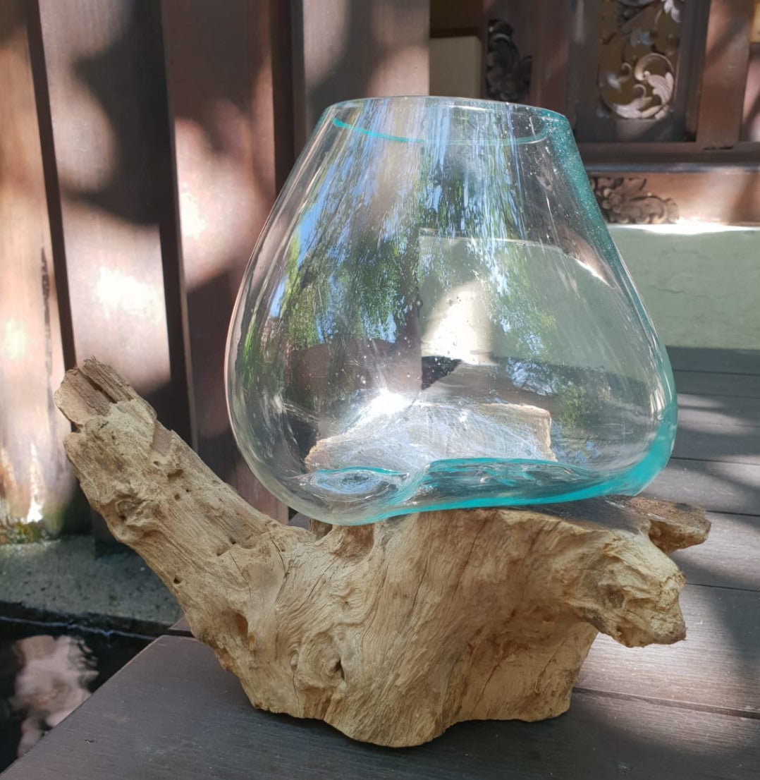 Recycled Glass Vase on Wood - Large Round - Clear & Blue with a turquoise-tinted rim resting on a pale branching wood base by Quintessential Holistic Health Ltd