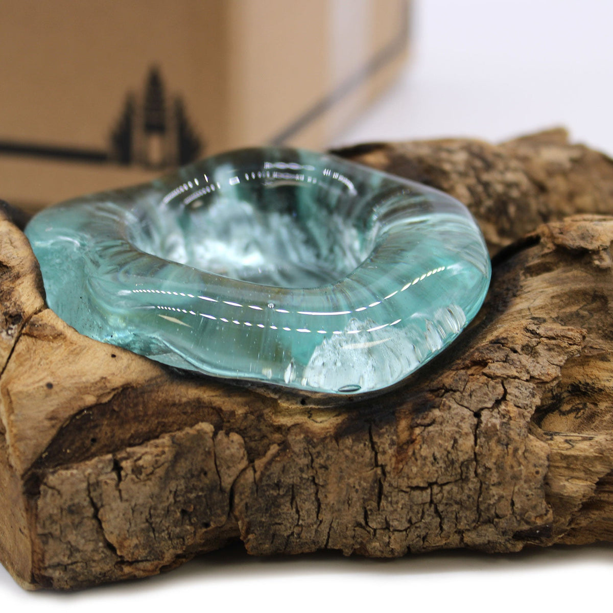 Recycled Glass Candle Holder on Wood - Single Round - Blue with an aqua glass cup resting on rugged brown wood by Quintessential Holistic Health Ltd