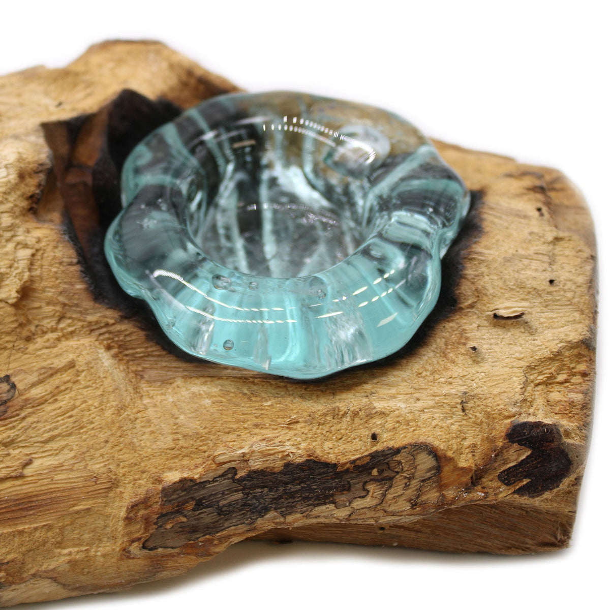 Recycled Glass/Wood Candle Holder - Triple Round - Clear/Light Blue with a close view of one thick, wavy glass holder on pale wood by Quintessential Holistic Health Ltd