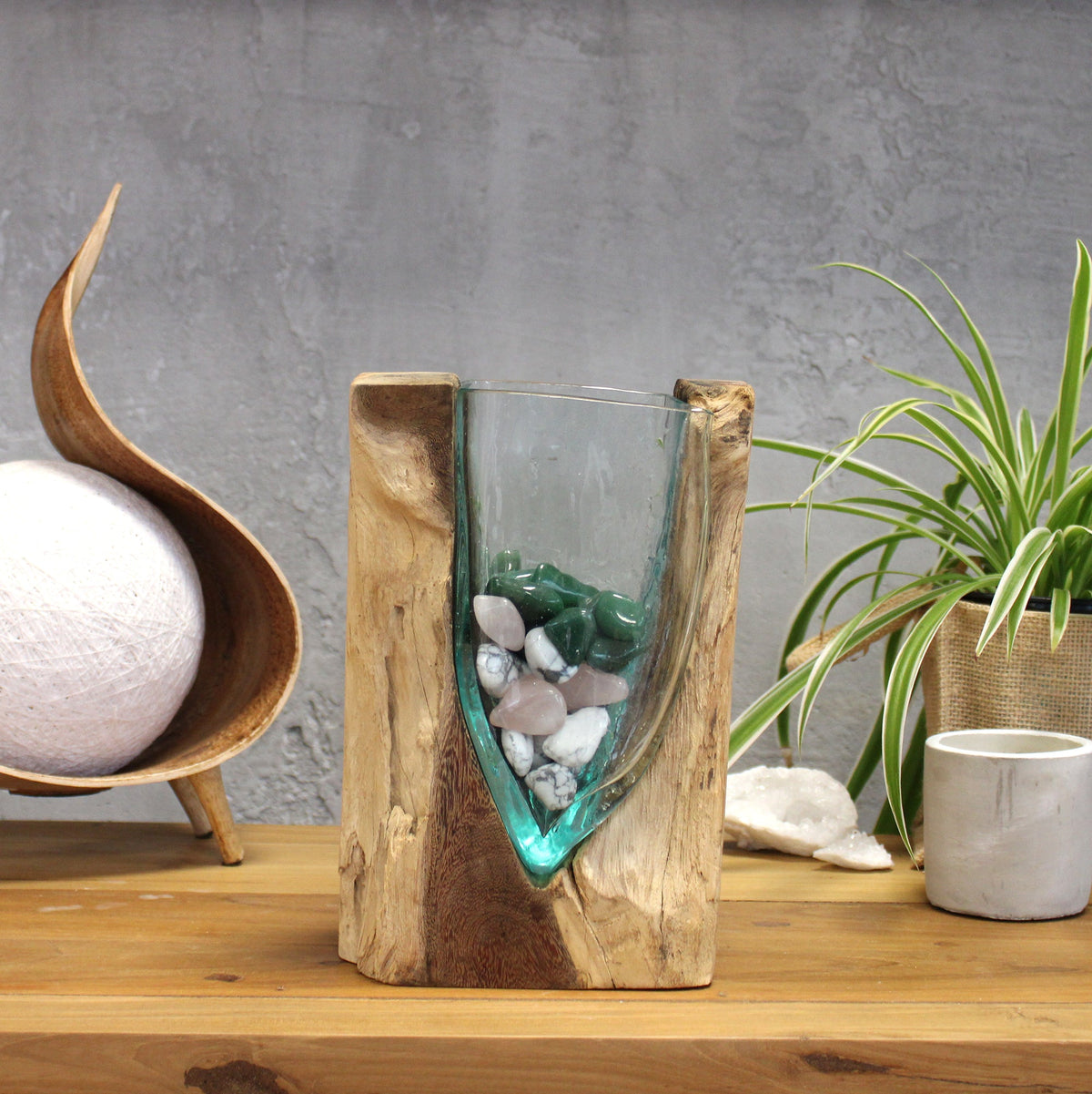 Handmade Molten Recycled V Shaped Vase - Clear and Light Blue, with white and green stones visible through the tapered glass by Quintessential Holistic Health Ltd