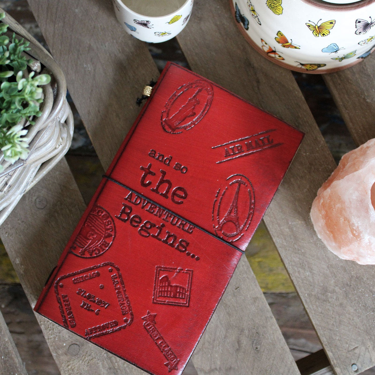 Handmade Slim Leather Journal - Red - The Adventure Begins, with embossed balloon and travel motifs and black elastic closure, by Quintessential Holistic Health Ltd