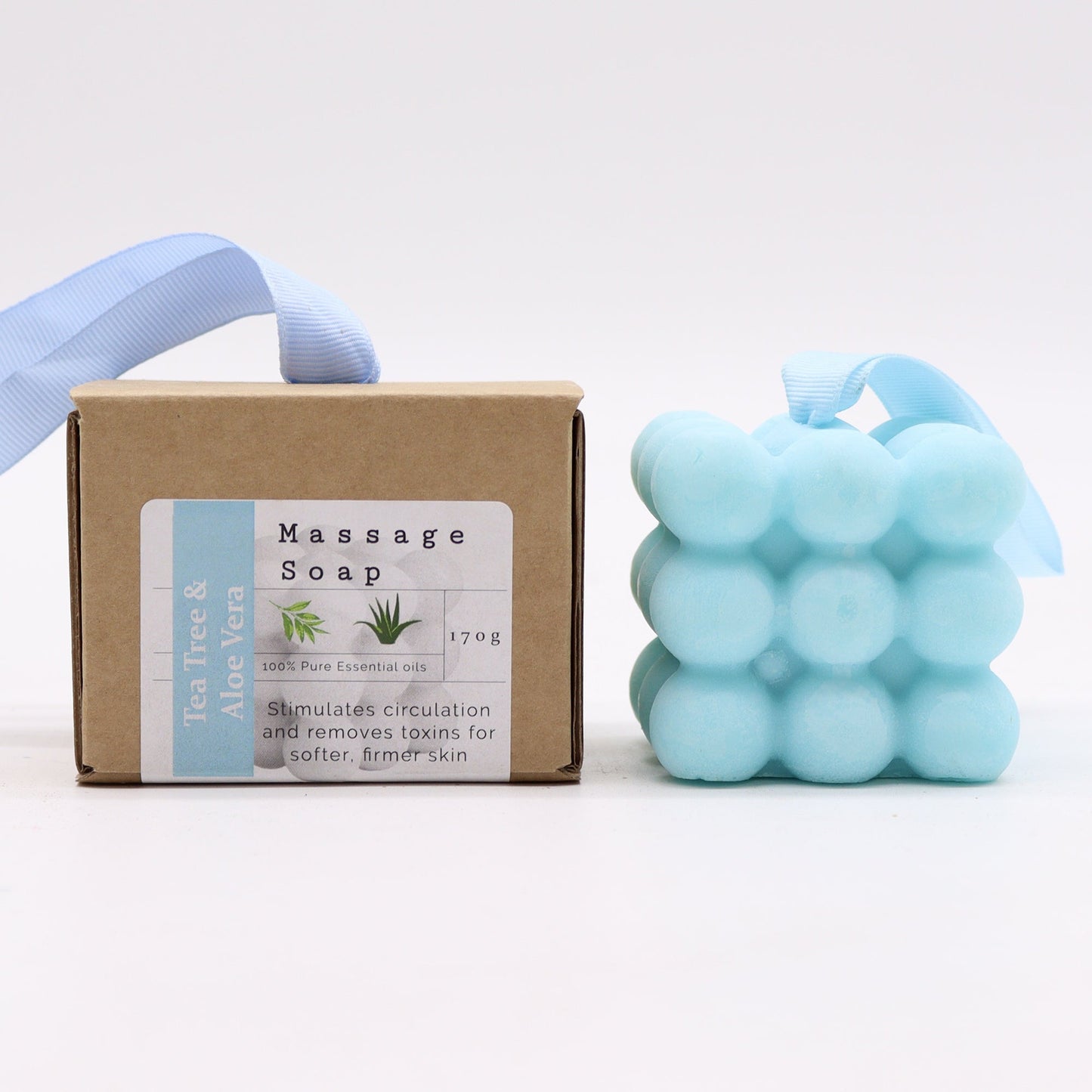 Massage Soap Bar - Tea Tree and Aloe Vera with a pale blue bubble design beside a labelled box, by Quintessential Holistic Health Ltd