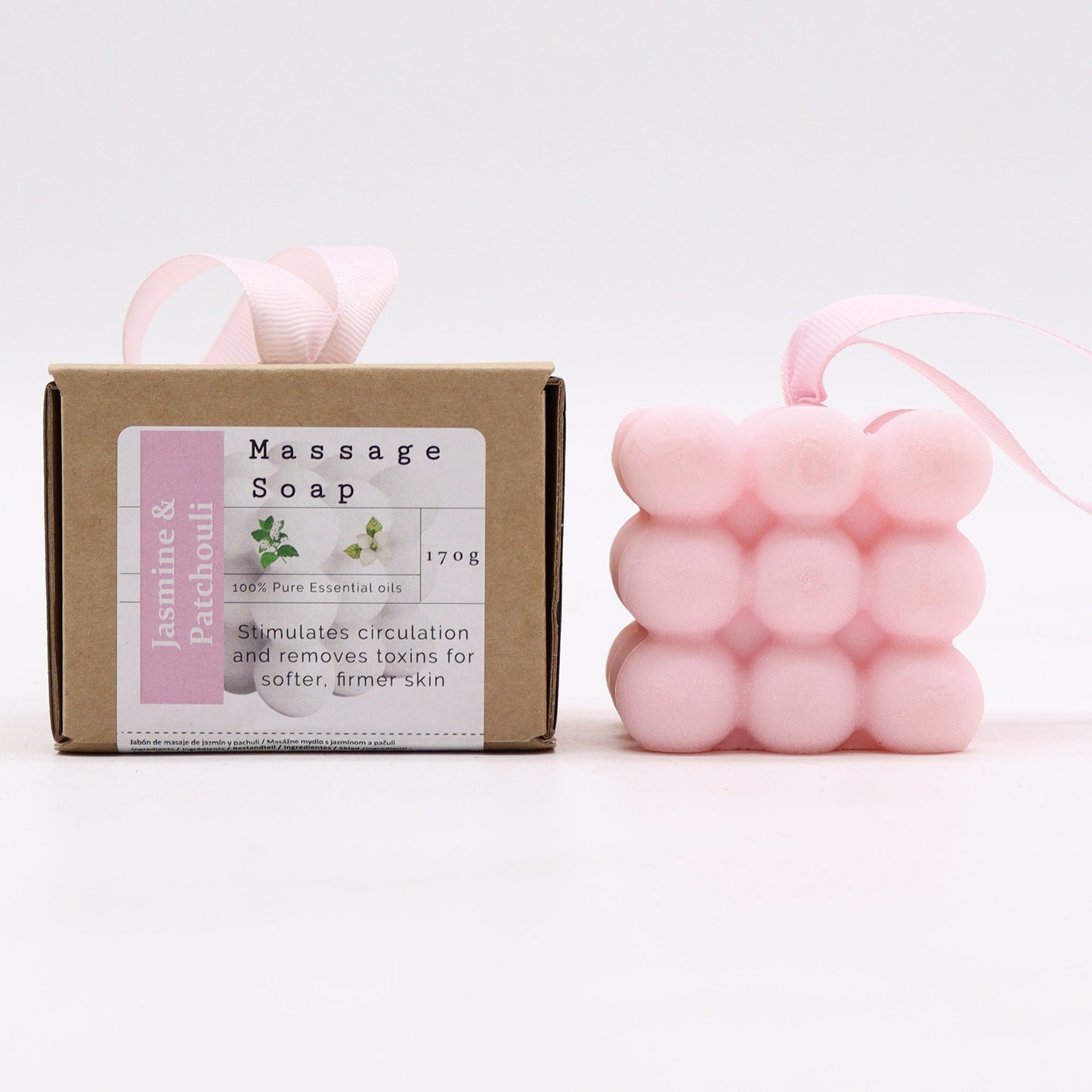Massage Soap Bar - Jasmine and Patchouli, with a pink bubble design and pale pink loop beside a labelled brown box by Quintessential Holistic Health Ltd