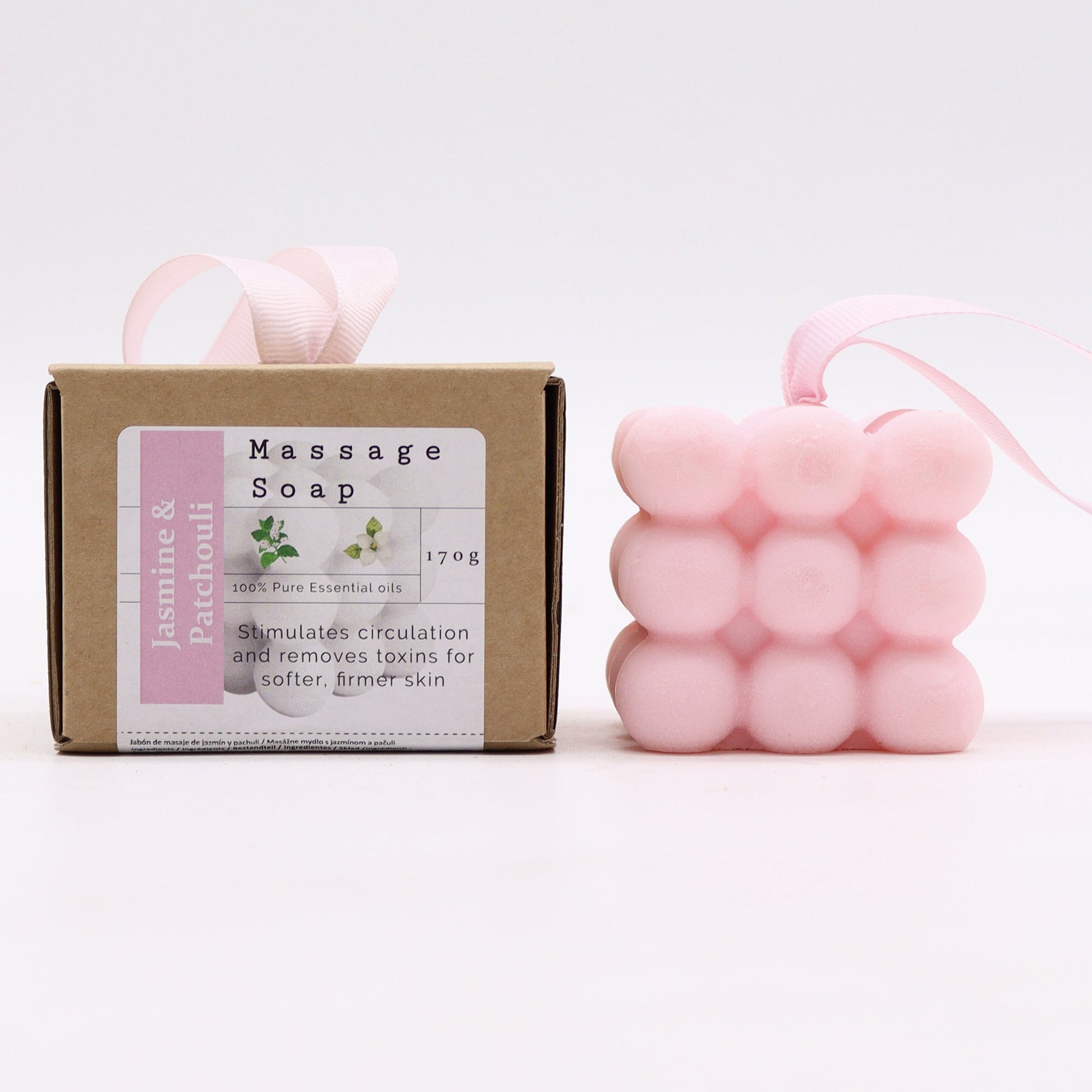 Massage Soap Bar - Jasmine and Patchouli, with a pink bubble design and pale pink loop beside a labelled brown box by Quintessential Holistic Health Ltd