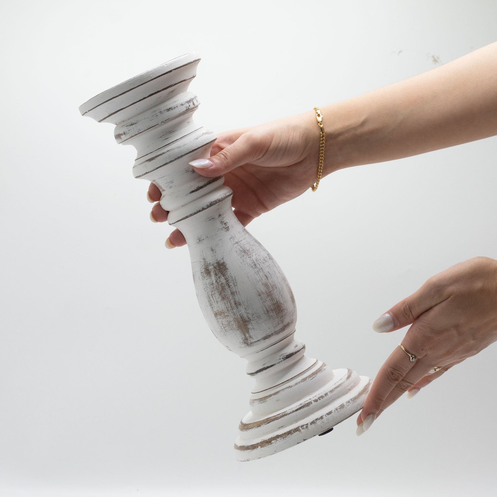 Handmade Mango Wood Candle Stand - Medium Whitewash, distressed white stand held horizontally between two hands by Quintessential Holistic Health Ltd