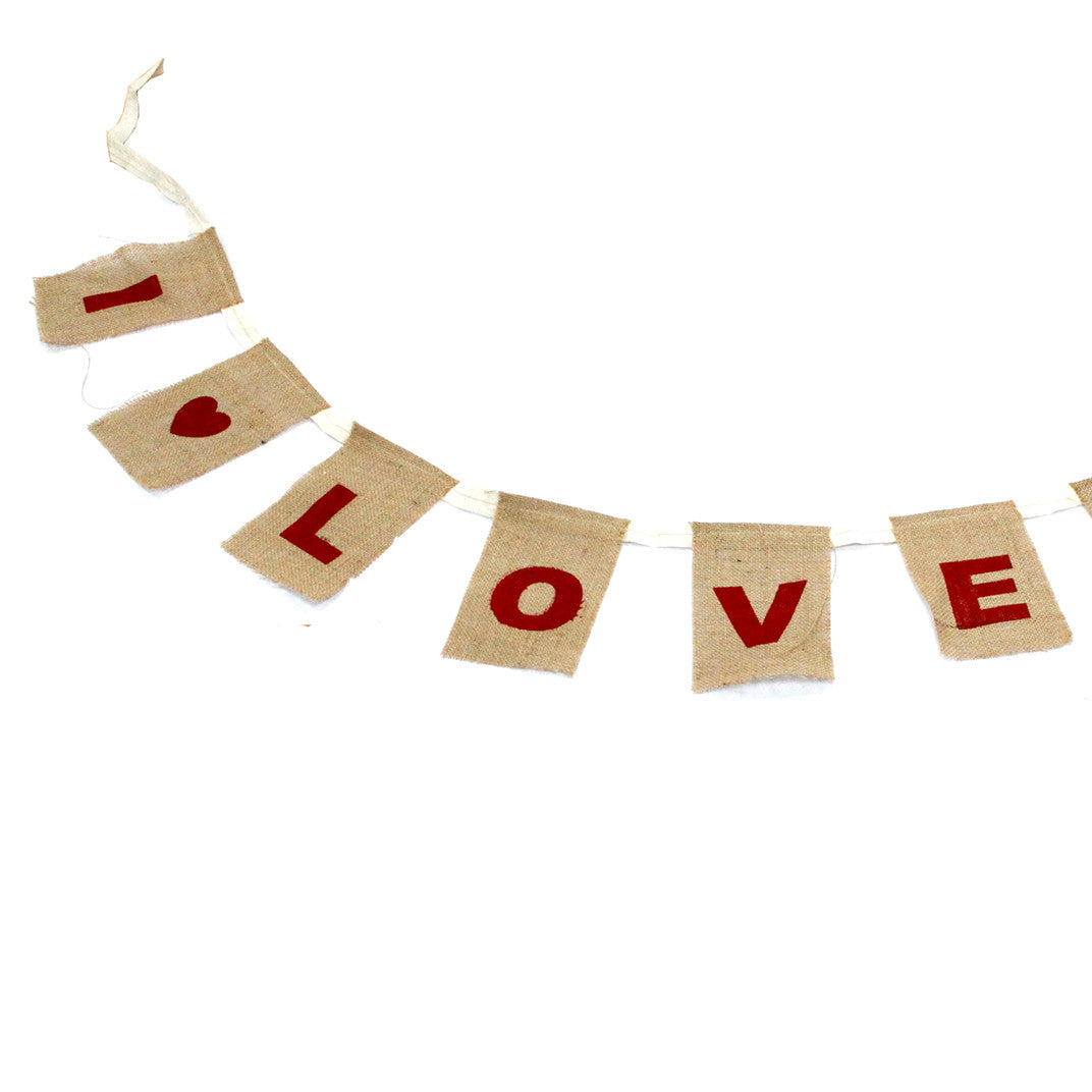 Natural Cotton Bunting - I Love You with Hearts arranged in a curve with widely spaced red letters and heart panels by Quintessential Holistic Health Ltd
