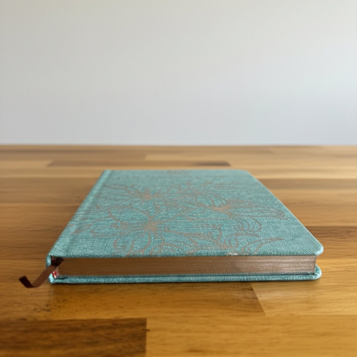 A5 Blue 'I Am Thankful For' Journal with Silver Lining, closed teal journal with a dark ribbon marker by Quintessential Holistic Health Ltd