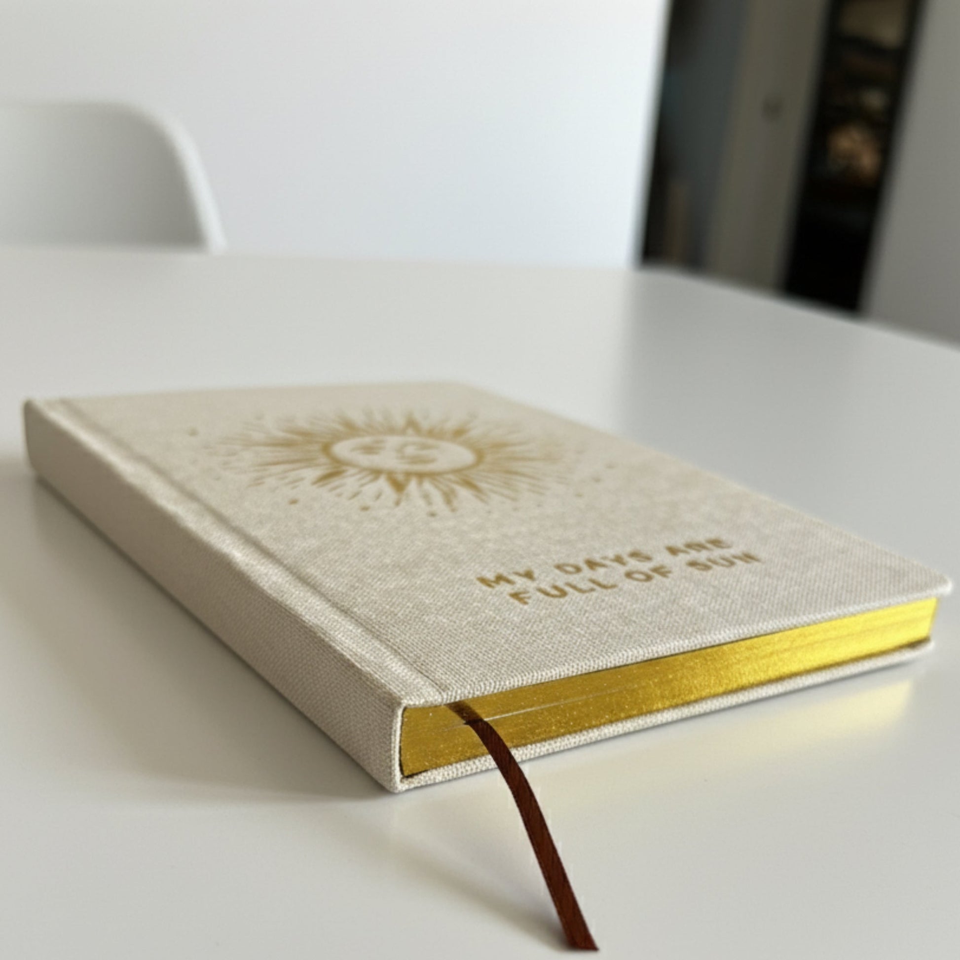 A5 Gratitude Journal with Gold Lining - Ivory / My Days are Full of Sun product packaging on clean background from Quintessential Holistic Health Ltd