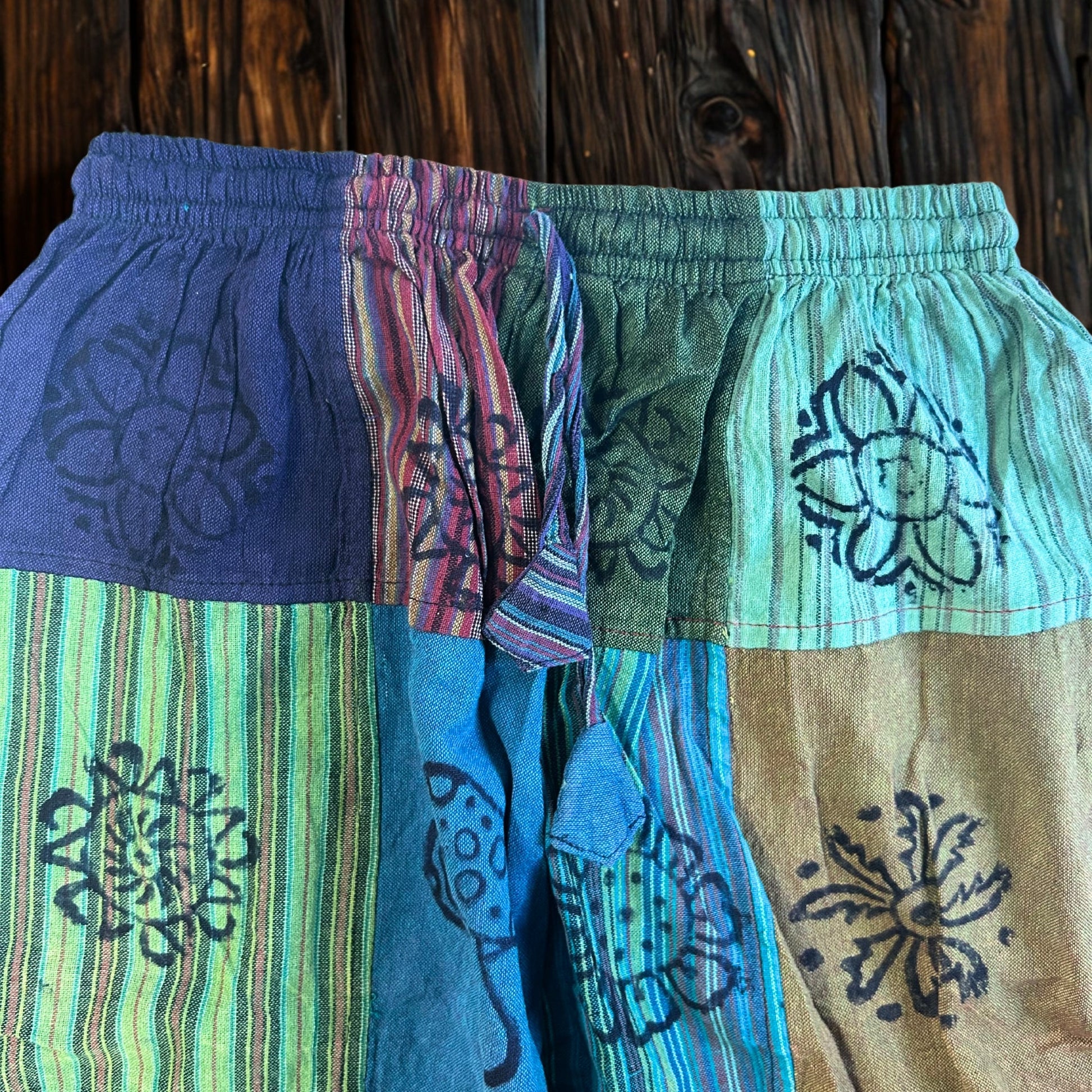 Nomad Sari Unisex Mushroom Pants - Small - Medium / Block Print / Green Tones product packaging on clean background from Quintessential Holistic Health Ltd
