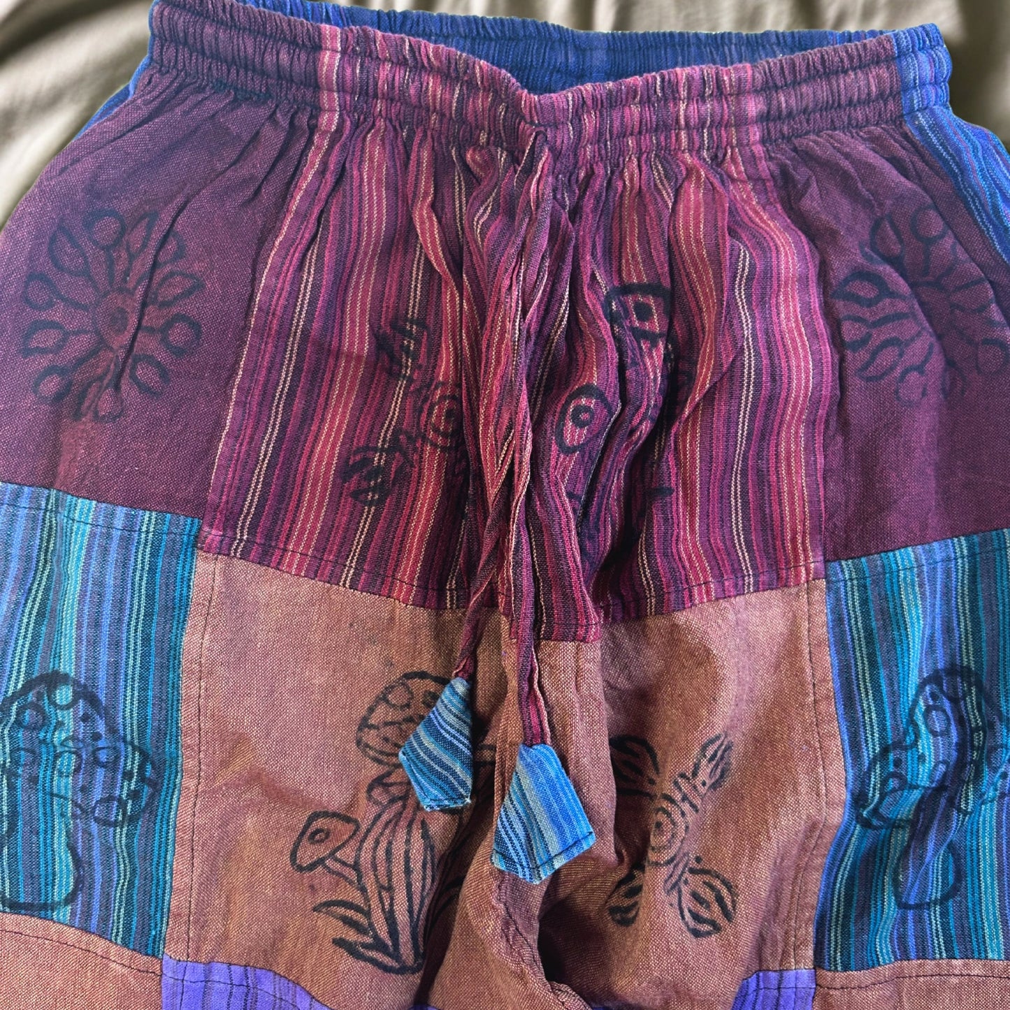Nomad Sari Unisex Mushroom Pants - Small - Medium / Block Print / Purple Tones product packaging on clean background from Quintessential Holistic Health Ltd
