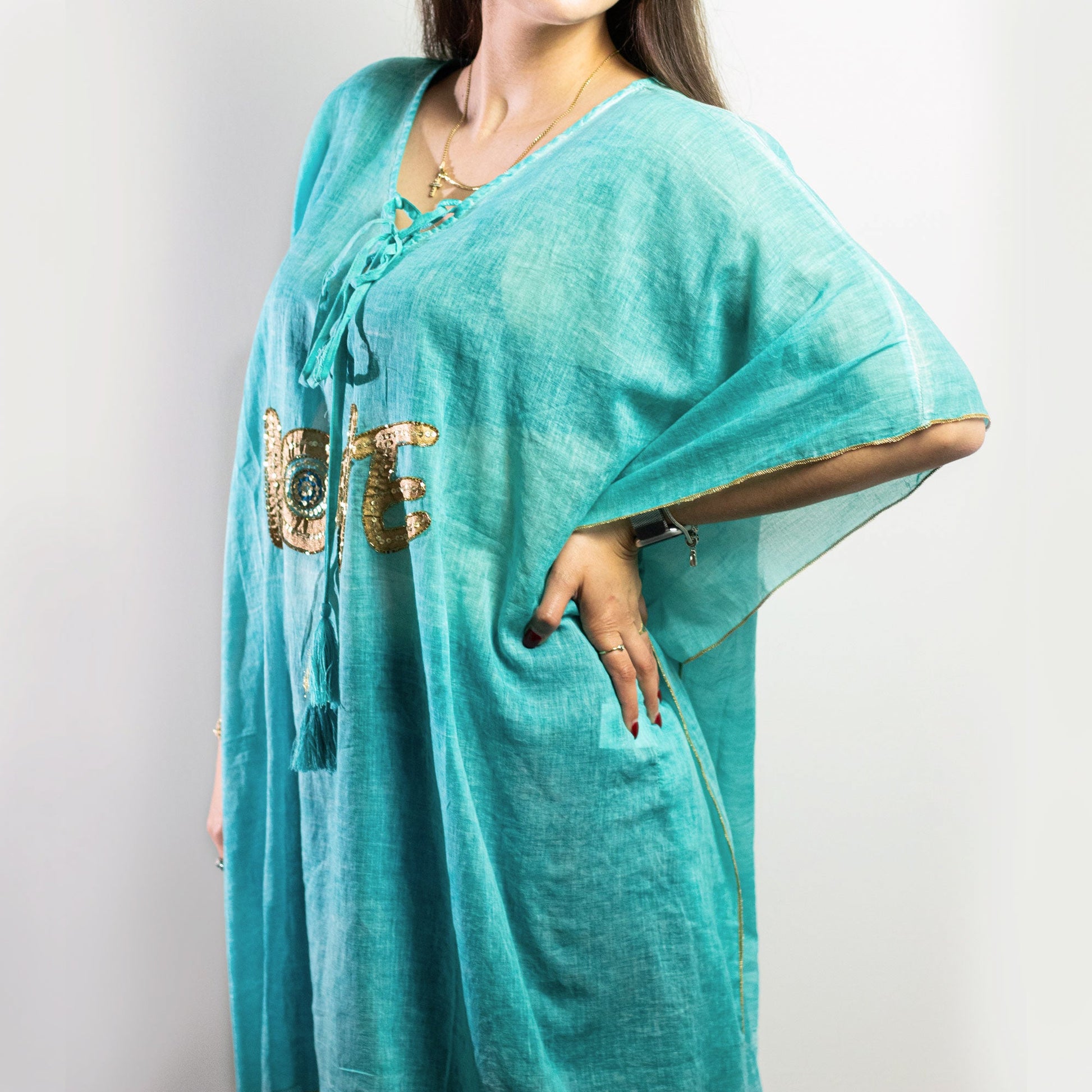 Hand Painted Eco-Friendly 100% Cotton Kaftan Sari Wrap - Love / Turquoise and Gold product packaging on clean background from Quintessential Holistic Health Ltd