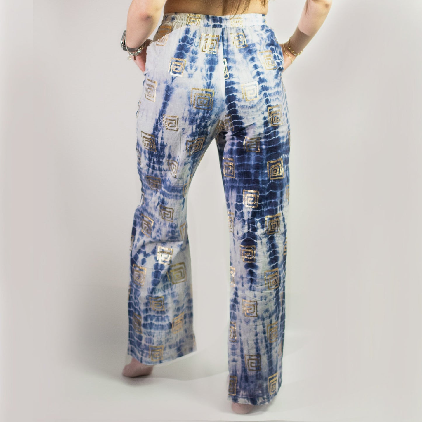 Nomad Sari Hand Painted Eco-Friendly 100% Cotton Lounge Pants - Large - Extra Large / Greek Motif / White, Blue and Gold product packaging on clean background from Quintessential Holistic Health