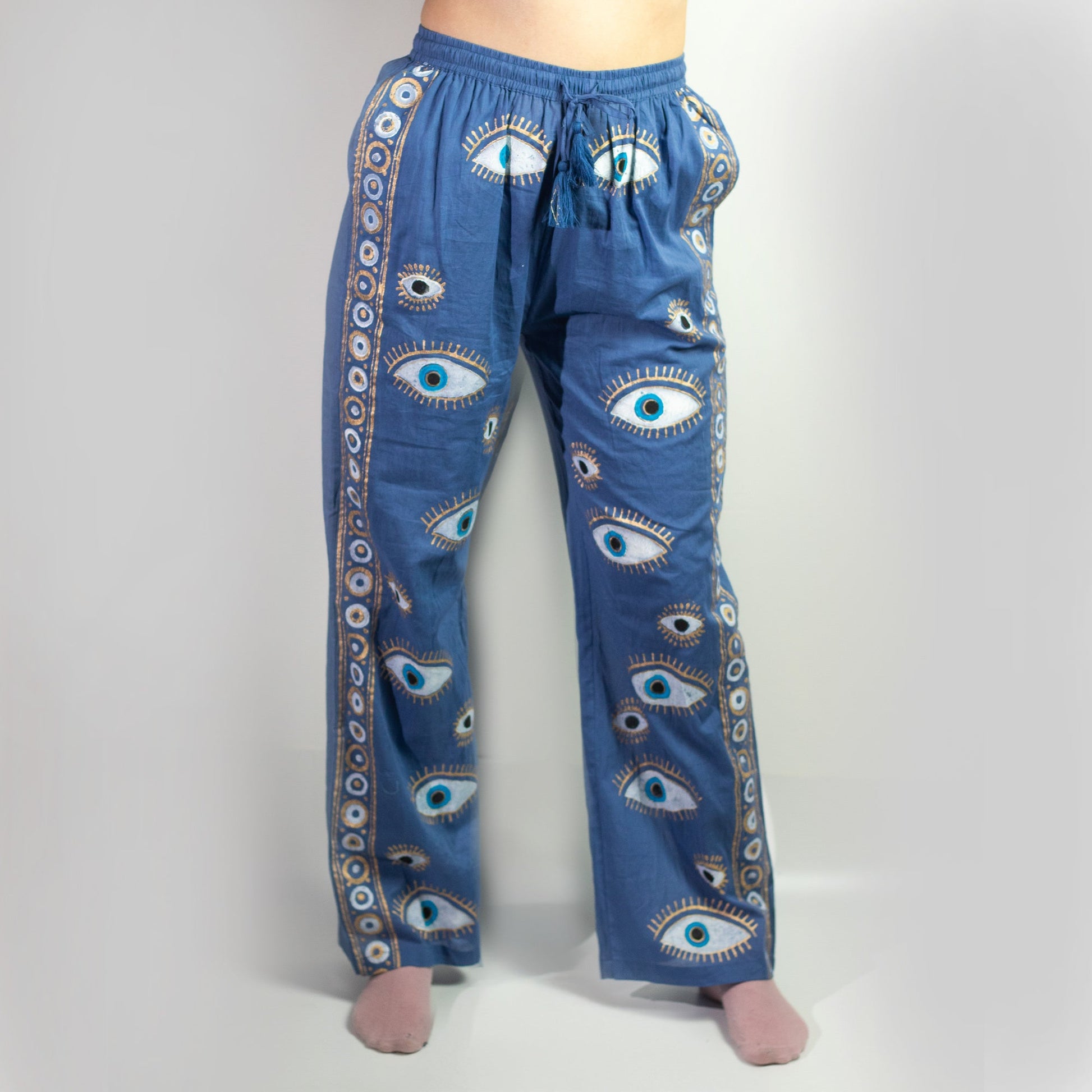 Nomad Sari Hand Painted Eco-Friendly 100% Cotton Lounge Pants - Large - Extra Large / All Seeing Eye / Blue and Gold product packaging on clean background from Quintessential Holistic Health Ltd