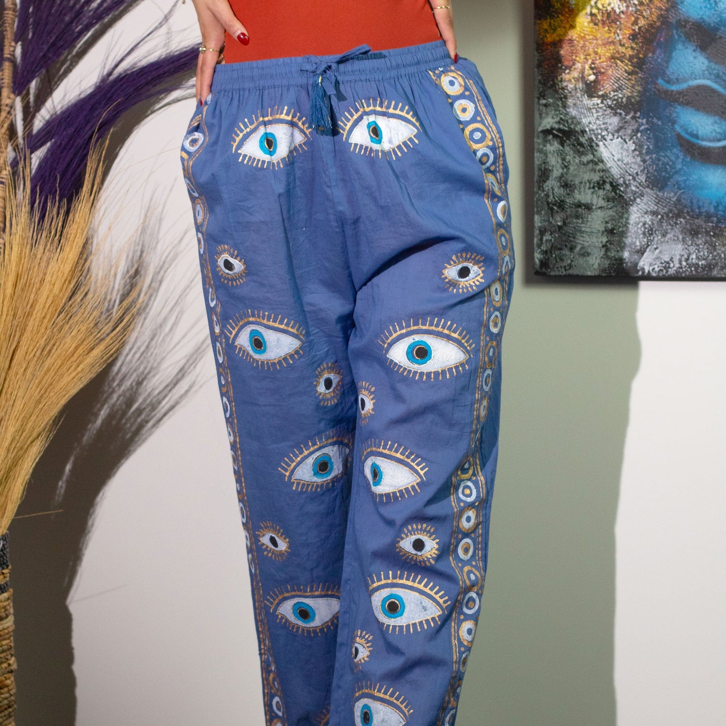Nomad Sari Hand Painted Eco-Friendly 100% Cotton Lounge Pants - Large - Extra Large / All Seeing Eye / Blue and Gold product packaging on clean background from Quintessential Holistic Health Ltd