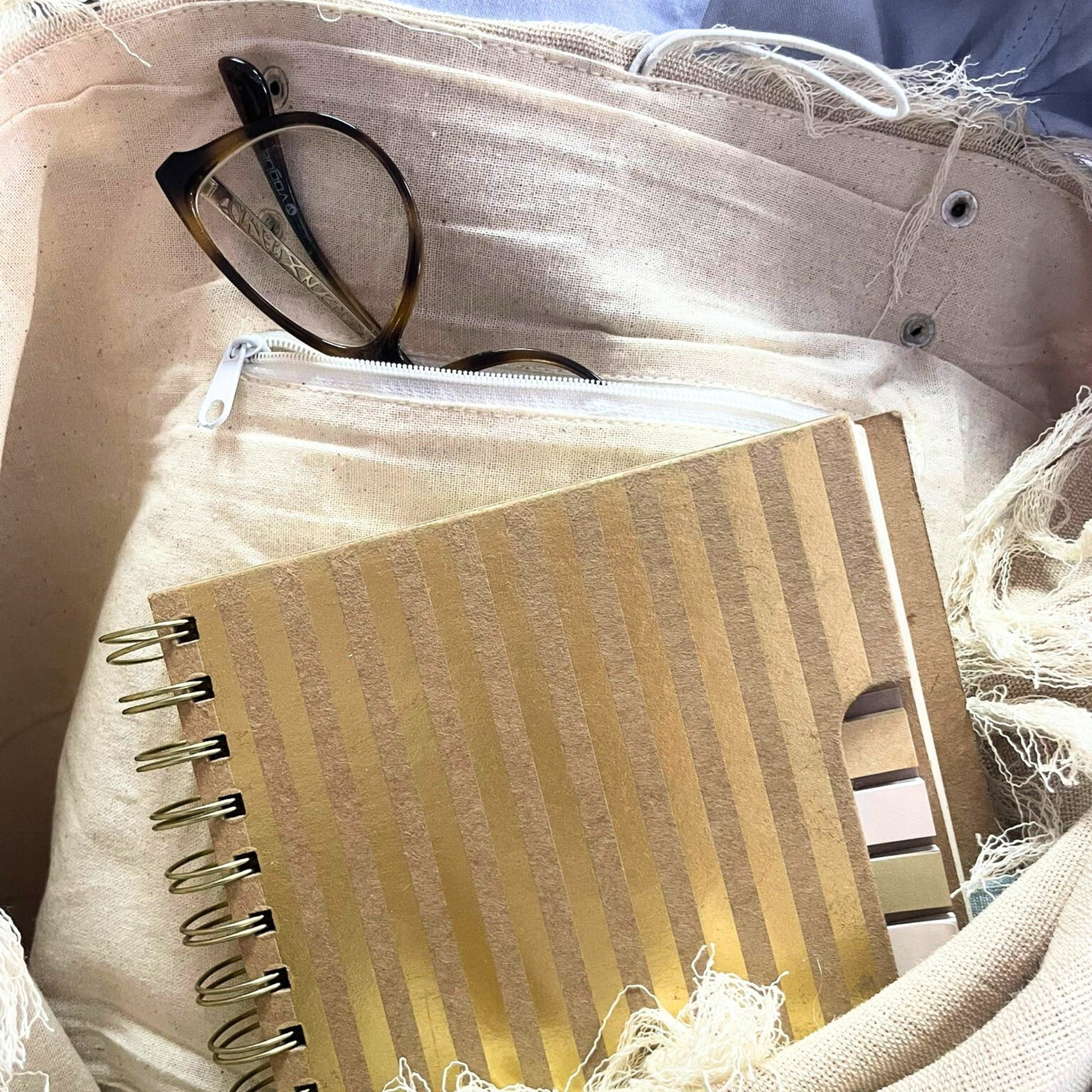 Natural Cotton Tote Bag with Leather Handles - Flower of Life showing an interior pocket holding glasses and a notebook by Quintessential Holistic Health Ltd