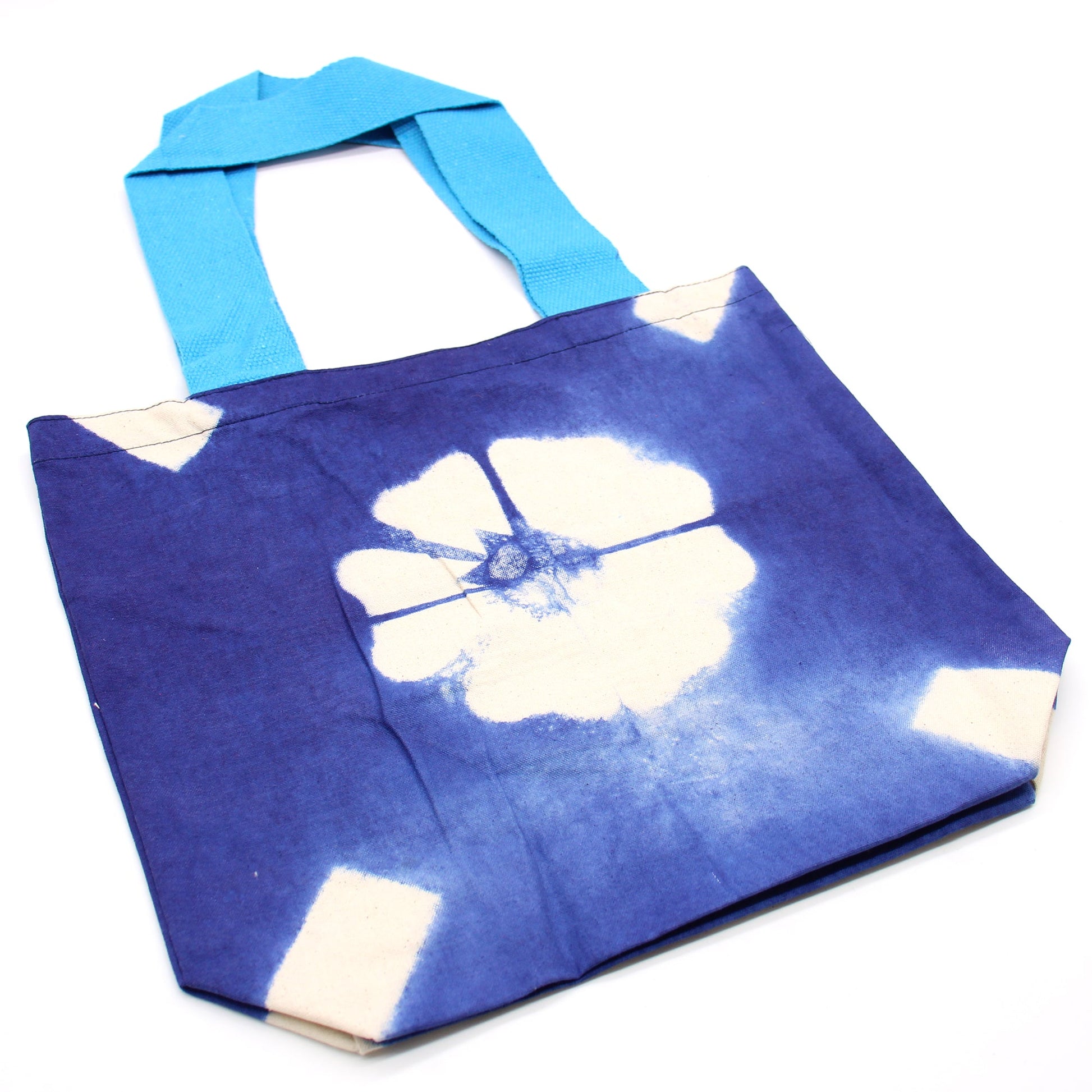 Handmade Eco-Friendly 100% Natural Cotton Tie-Dyed Bag - Blue Flower with a Blue Handle product packaging on clean background from Quintessential Holistic Health Ltd