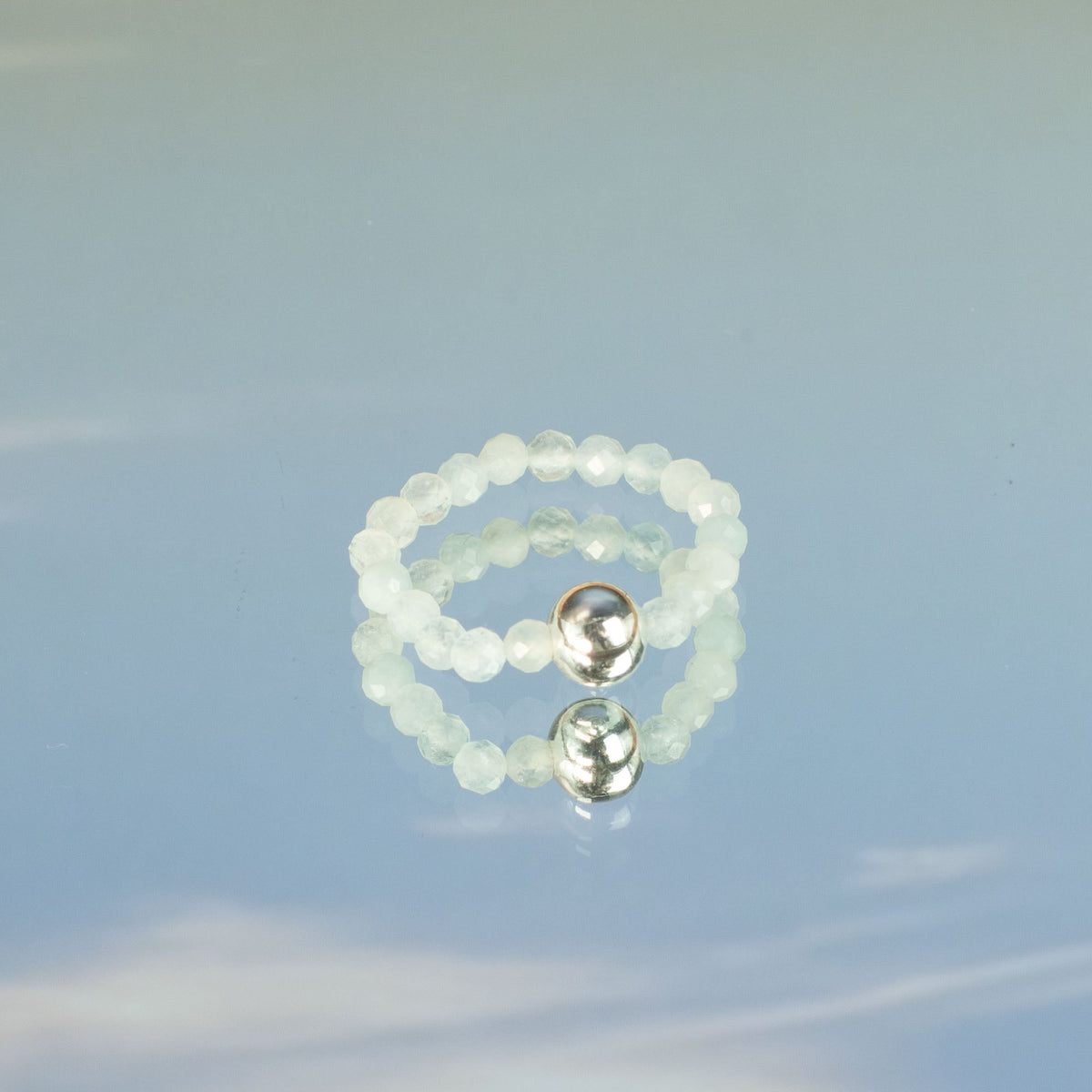 Mystical Nymph Spirit Gemstone 3-Ring Set – Sea Sunset showing a pale translucent beaded ring with two silver-tone beads by Quintessential Holistic Health Ltd