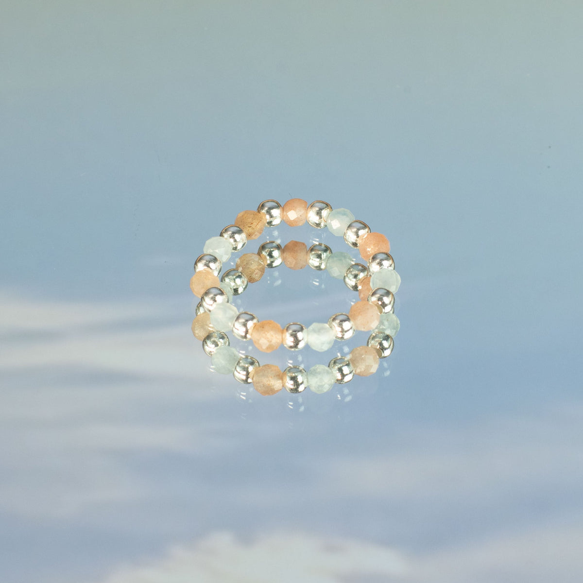 Mystical Nymph Spirit Gemstone 3-Ring Set – Sea Sunset showing a pale blue and peach beaded ring with silver-tone accents by Quintessential Holistic Health Ltd
