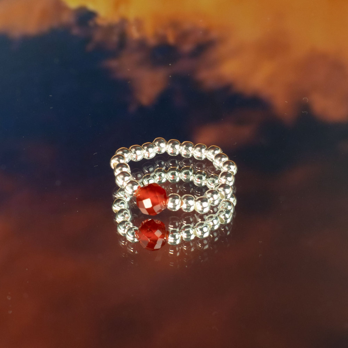 Mystical Nymph Spirit Gemstone 3-Ring Set – Blood Moon, clear beaded rings stacked around red and silver-toned accent beads by Quintessential Holistic Health Ltd