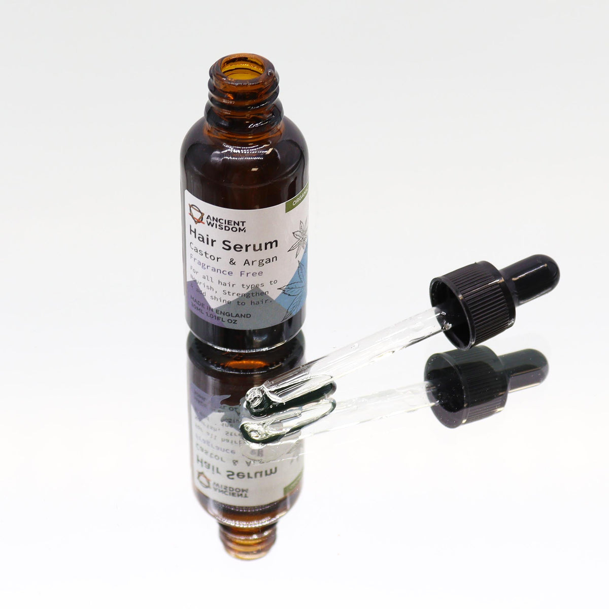 Organic Vegan-Friendly Unfragranced Hair Serum - 30ml, open amber bottle beside two glass droppers, by Quintessential Holistic Health Ltd