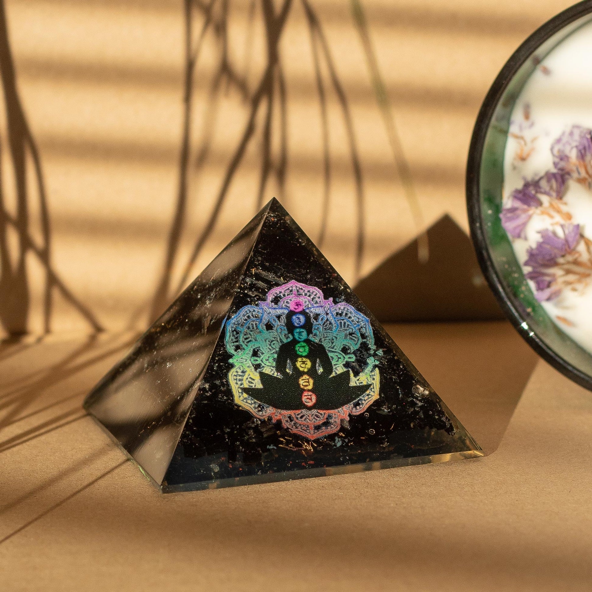 Handmade Orgonite Desk Power Pack / Paperweight - Small / Pyramid / Buddha Chakra / Black Tormaline product packaging on clean background from Quintessential Holistic Health Ltd