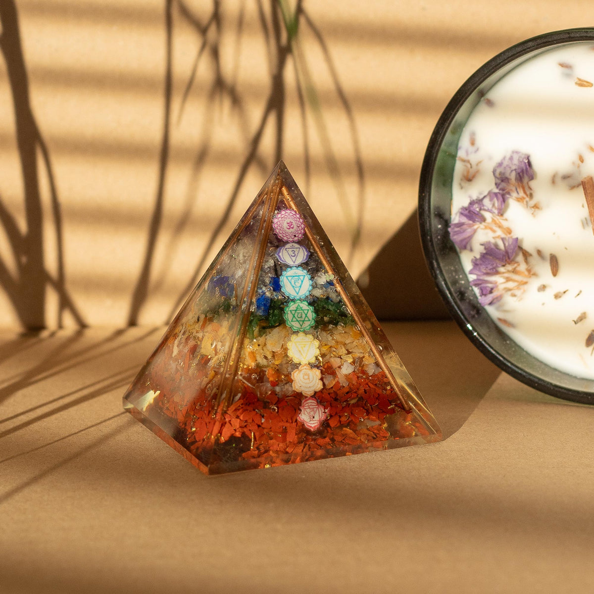 Orgonite Paperweight - Medium 7 Chakra Copper Pyramid, with seven coloured chakra symbols above a red-chip base by Quintessential Holistic Health Ltd