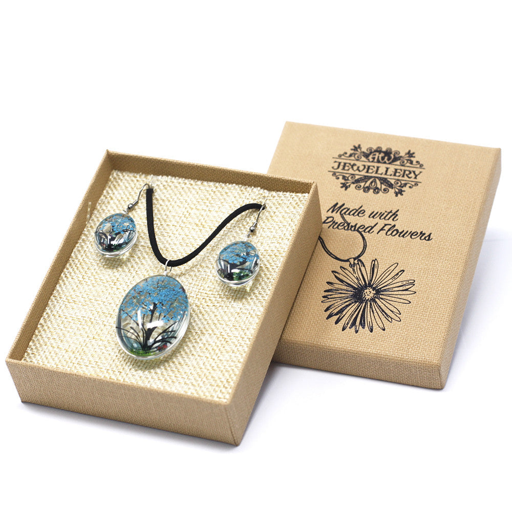 Pressed Flowers Pendant and Earring Set - Tree of Life / Teal product packaging on clean background from Quintessential Holistic Health Ltd