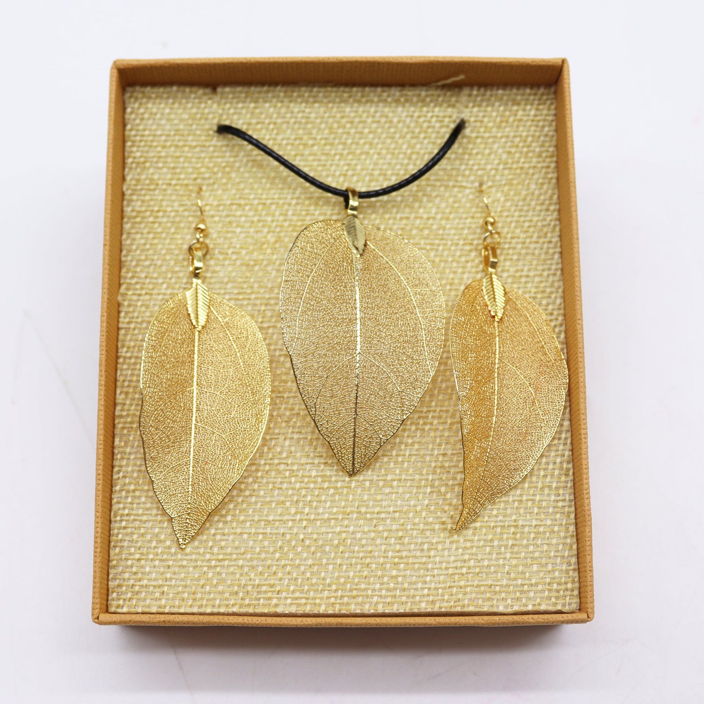 Real Leaf Necklace and Earring Set - Gold product packaging on clean background from Quintessential Holistic Health Ltd