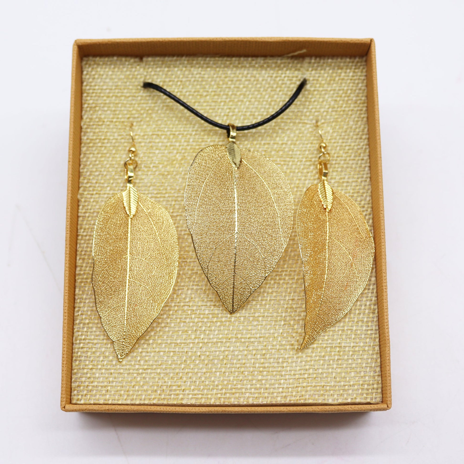 Real Leaf Necklace and Earring Set - Gold product packaging on clean background from Quintessential Holistic Health Ltd